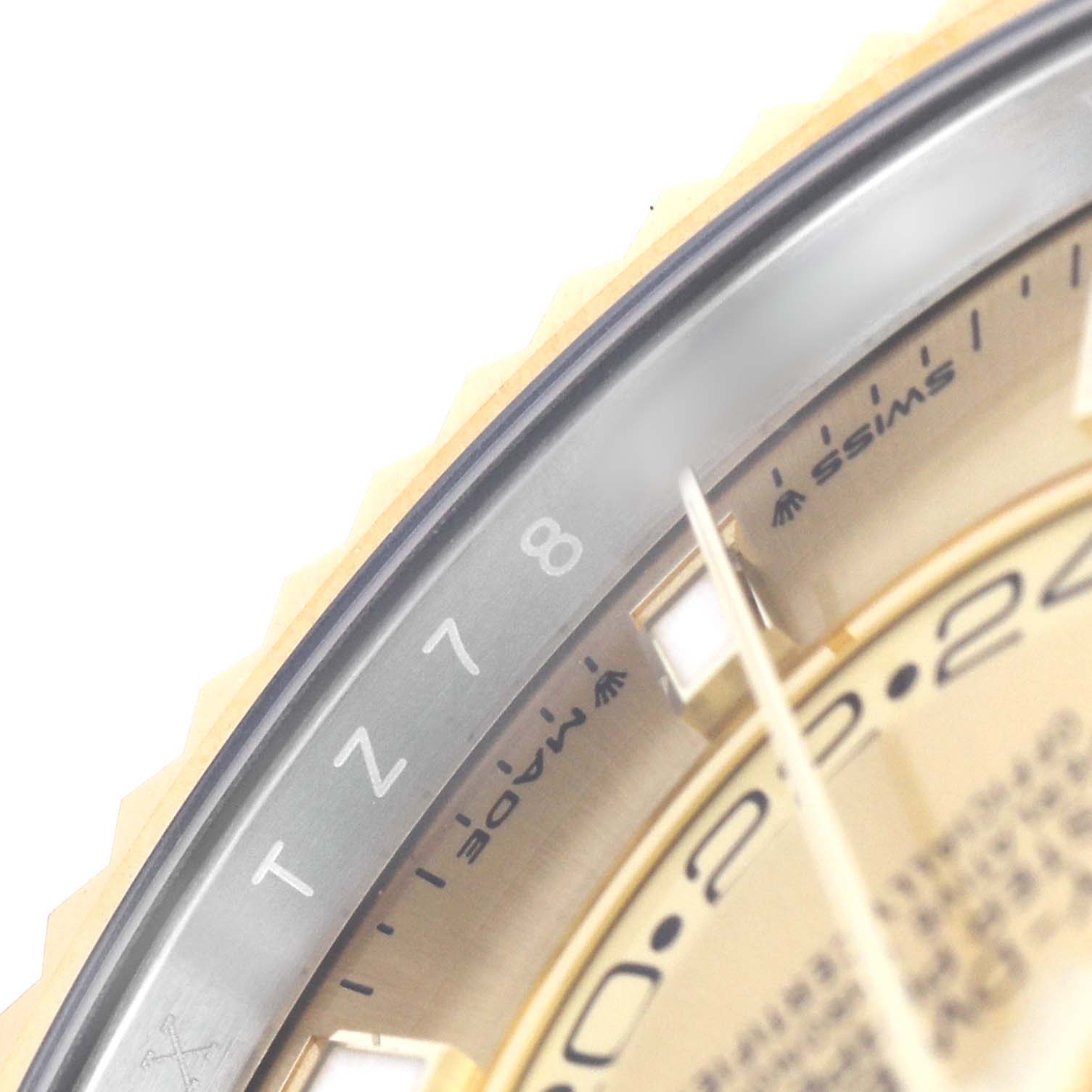 The image shows a close-up of the Rolex Sky-Dweller 336933 Men's Steel and Gold (two tone) Champagne Dial watch face, highlighting the bezel and part of the dial.
