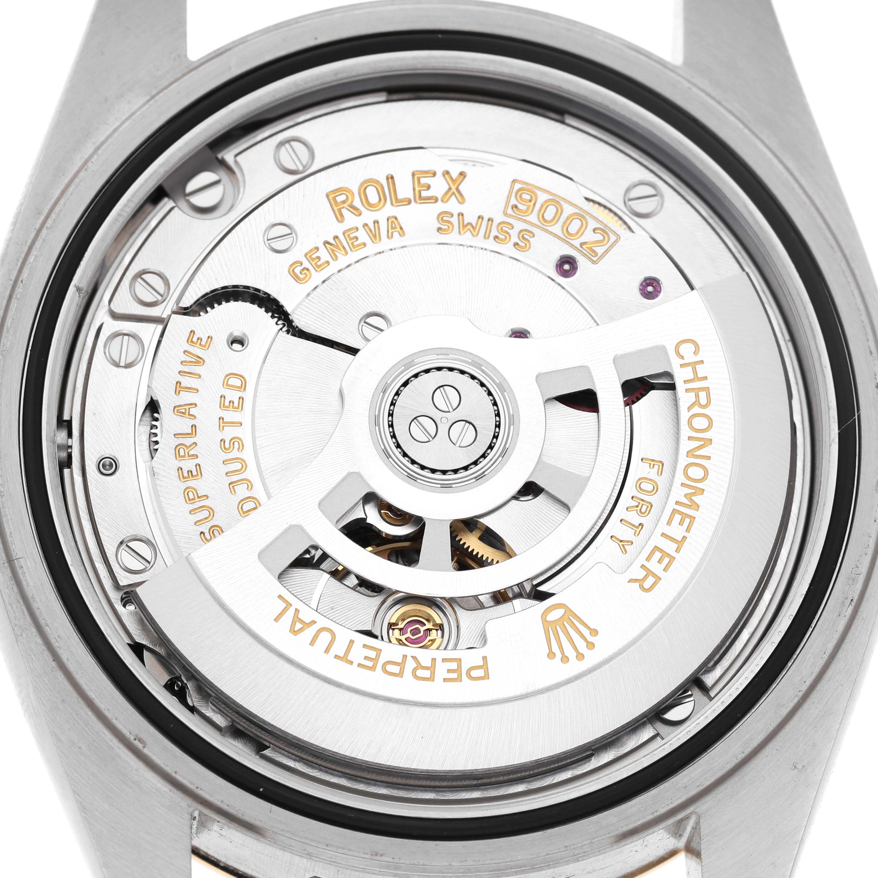 The image shows the Rolex Sky-Dweller 336933 Men's Steel and Gold (two tone) Champagne Dial's movement, viewed from the back, highlighting the rotor and engraved markings.