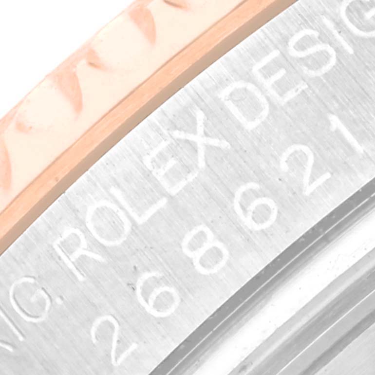 The image shows a close-up view of the side engraving and part of the bezel of a Rolex Yacht-Master 268621 Men's Steel and Gold (two tone) Brown Dial 268621 Men's Steel and Gold (two tone) Brown Dial watch.