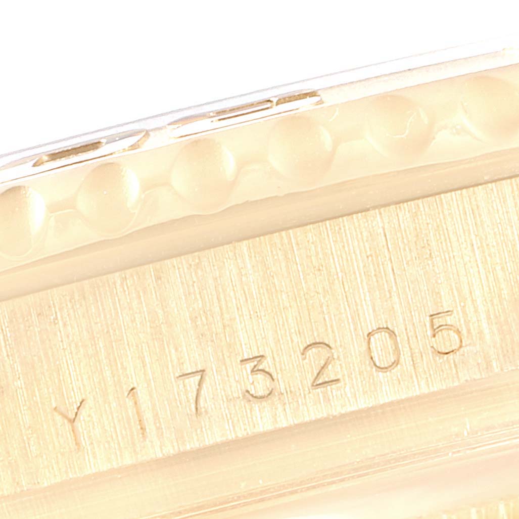 The image shows a close-up of the side engraving and bezel of a Rolex Yacht-Master 16628 Men's Yellow Gold White Dial 16628 Men's Yellow Gold White Dial watch.