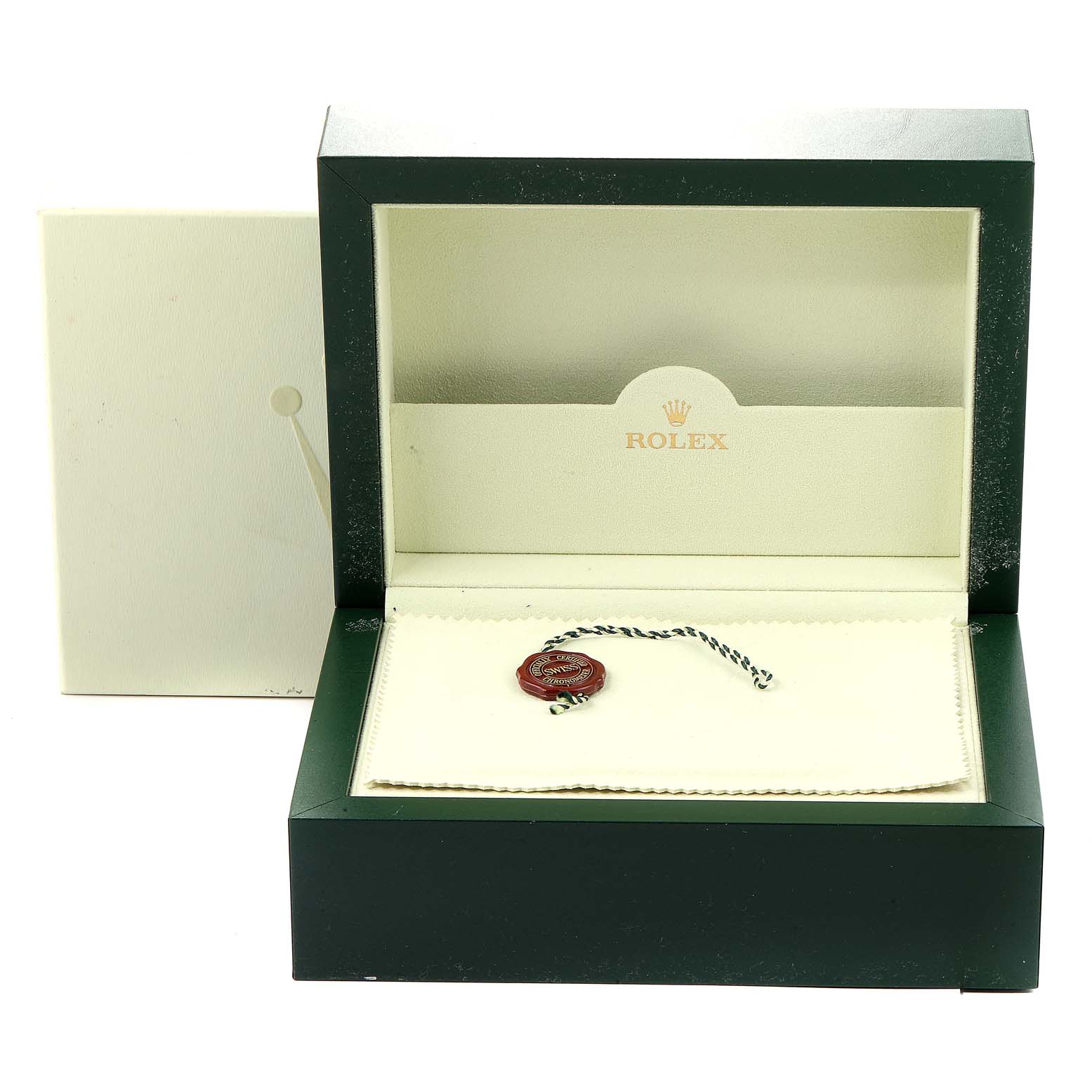 The image shows an open Rolex watch box for the Yacht-Master model, containing a Rolex seal and cloth.