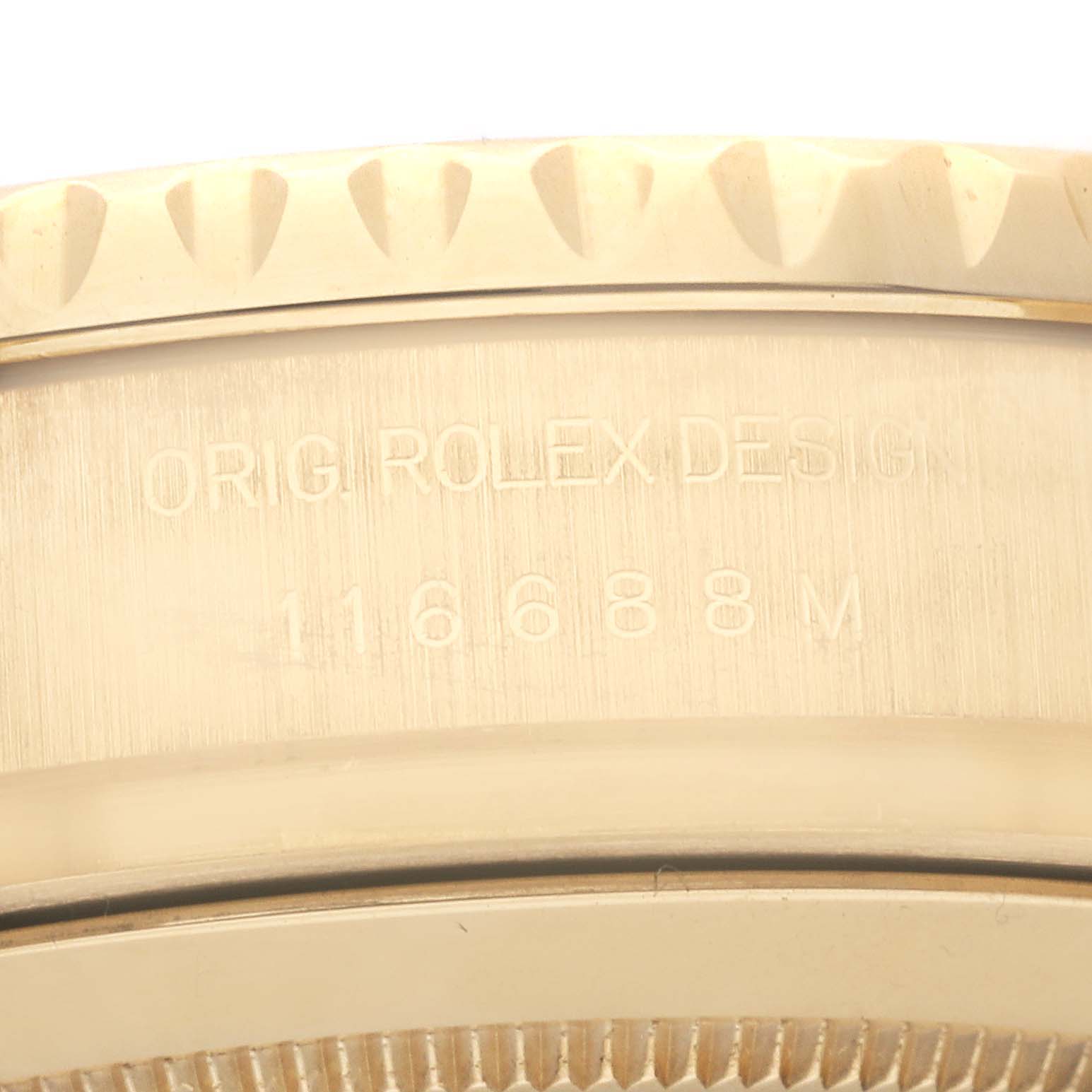 This close-up image of a Rolex Yacht-Master 116688 Men's Yellow Gold White Dial 116688 Men's Yellow Gold White Dial watch shows the bezel edge and engraved model number "116688M" on the case.