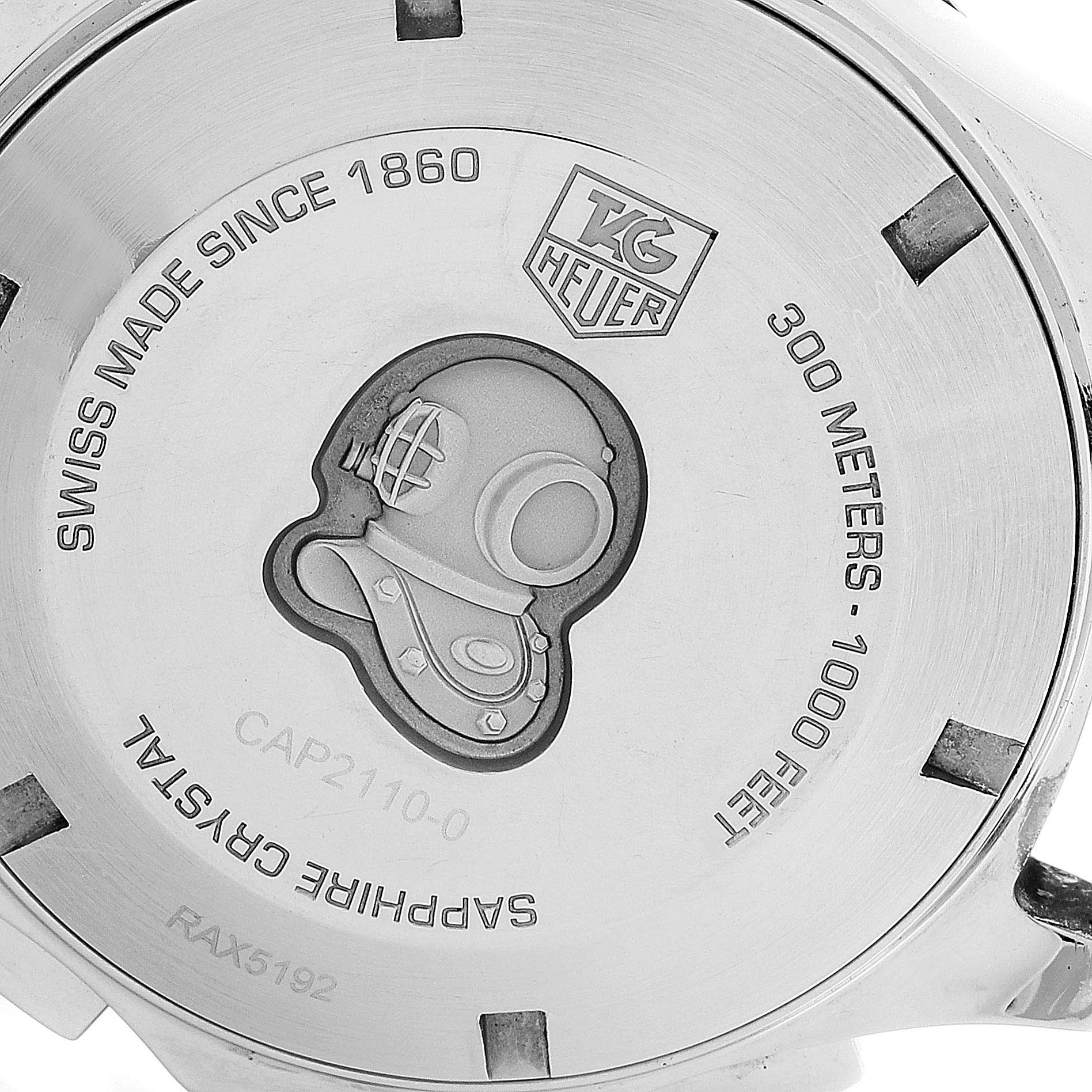 The image shows the back case of a Tag Heuer Aquaracer CAP2110.BA0833 Men's Stainless Steel Black Dial CAP2110.BA0833 Men's Stainless Steel Black Dial watch, highlighting the diver helmet engraving and various inscriptions.