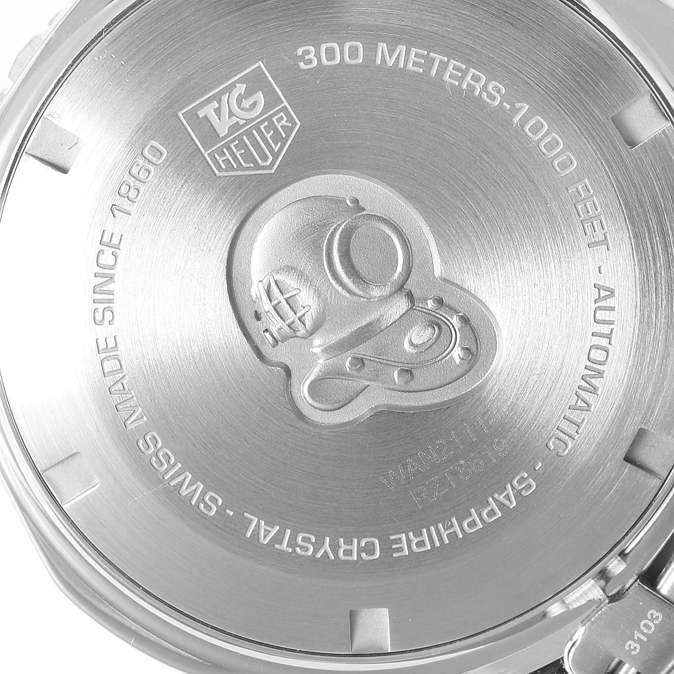 The image shows the back case of the Tag Heuer Aquaracer WAN2111.BA0822 Men's Stainless Steel Blue Dial WAN2111.BA0822 Men's Stainless Steel Blue Dial watch, featuring engravings and a diving helmet design.