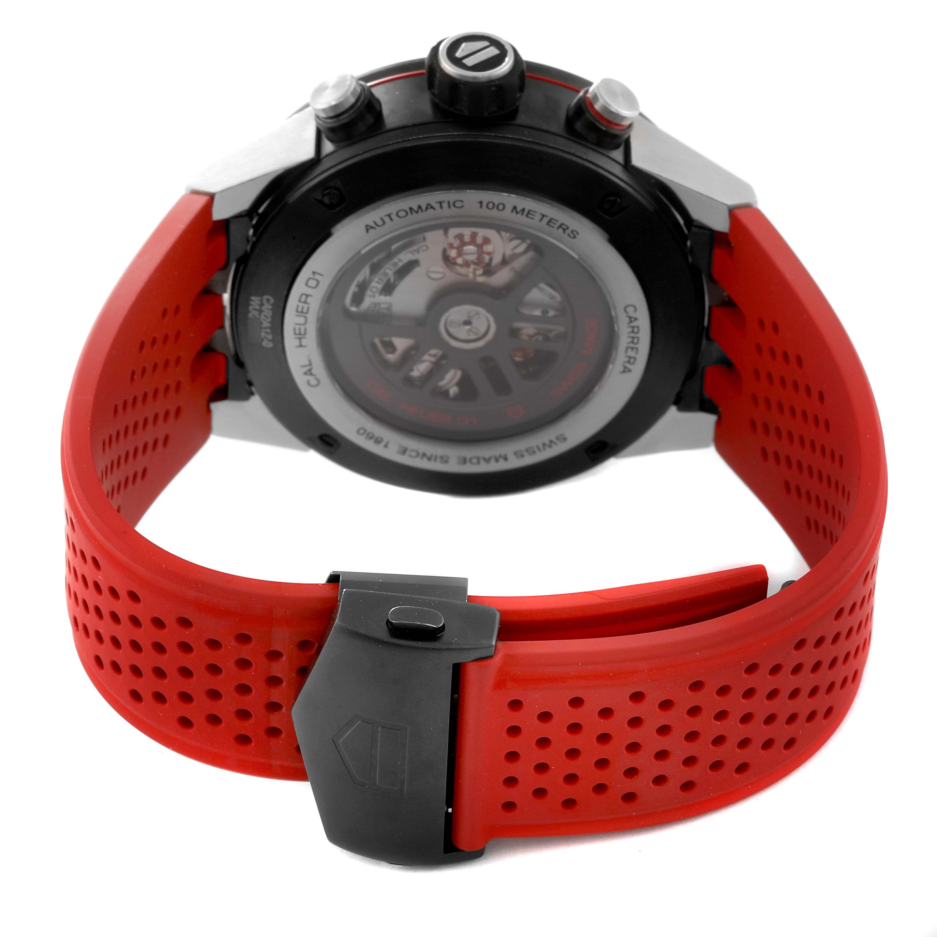 The image shows the back of a Tag Heuer Carrera CAR2A1Z.FT6044 Men's Stainless Steel Black Dial CAR2A1Z.FT6044 Men's Stainless Steel Black Dial watch with a red perforated strap and clasp.