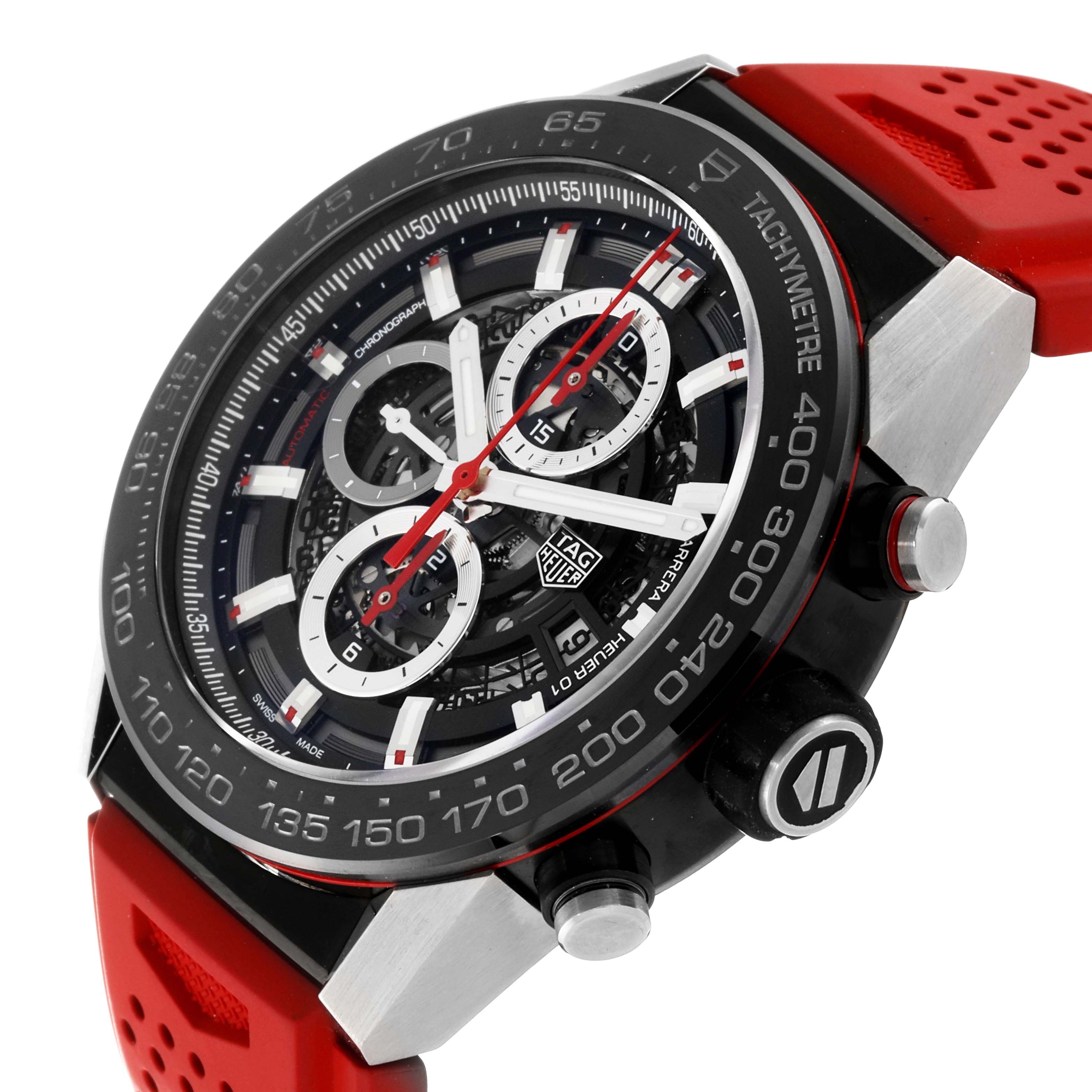 The Tag Heuer Carrera CAR2A1Z.FT6044 Men's Stainless Steel Black Dial CAR2A1Z.FT6044 Men's Stainless Steel Black Dial watch is shown at a slightly tilted angle, highlighting its red strap, black tachymeter bezel, and chronograph dials.
