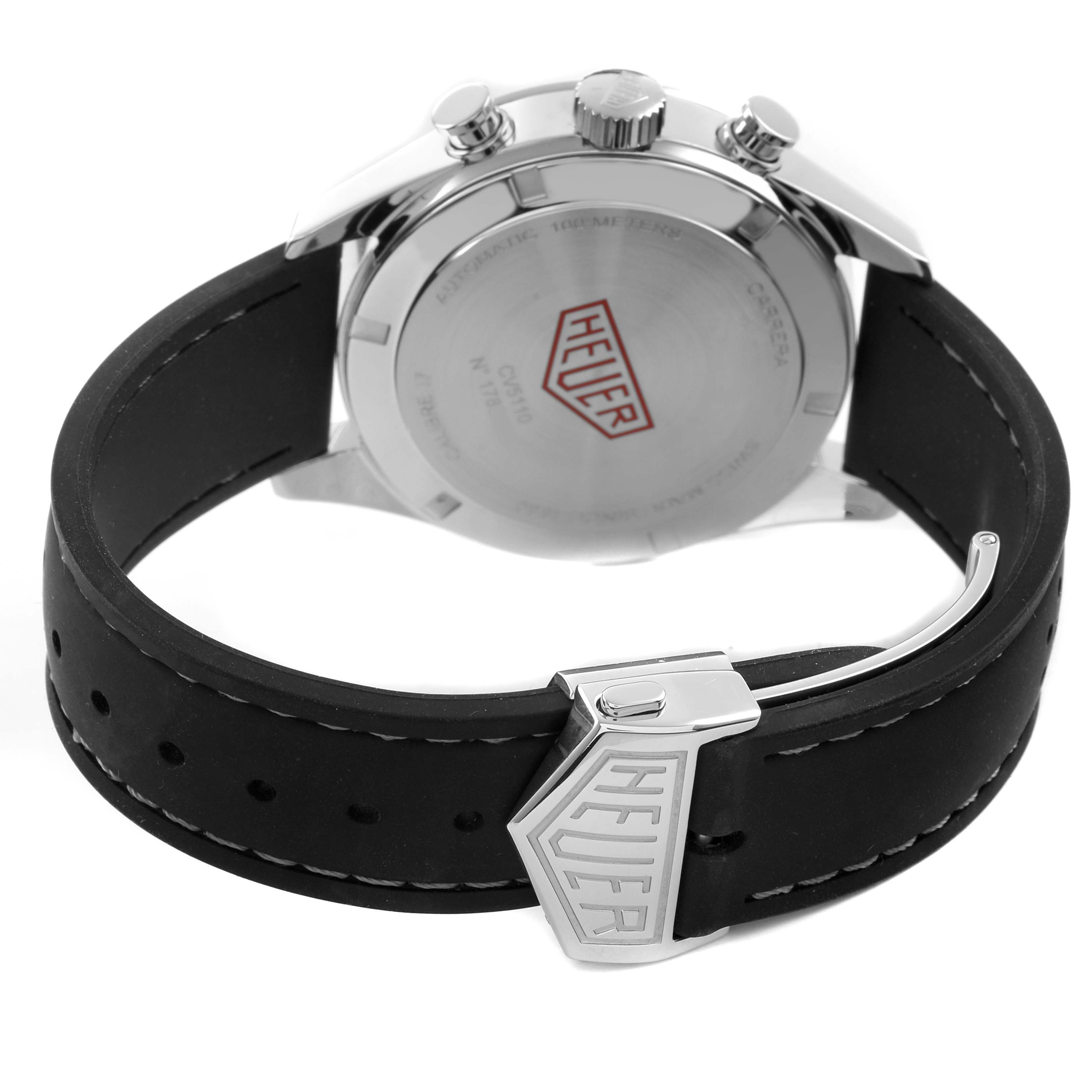 The image shows the back of a Tag Heuer Carrera CV5110.FC6310 Men's Stainless Steel Grey Dial watch with its case back, crown, pushers, and clasp on the leather strap visible.