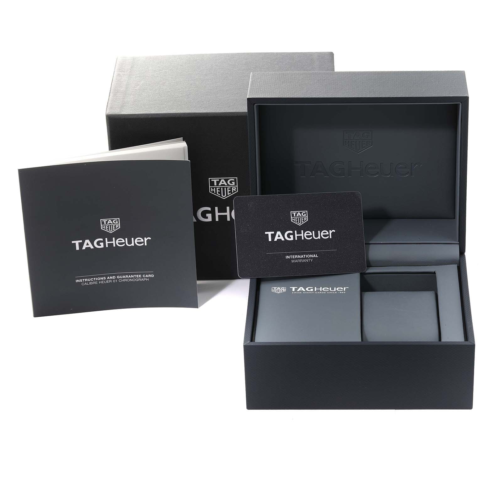 The image shows the packaging, warranty card, and instruction manual for a Tag Heuer Carrera CAR201T.BA0766 Men's Stainless Steel Blue Dial CAR201T.BA0766 Men's Stainless Steel Blue Dial watch.