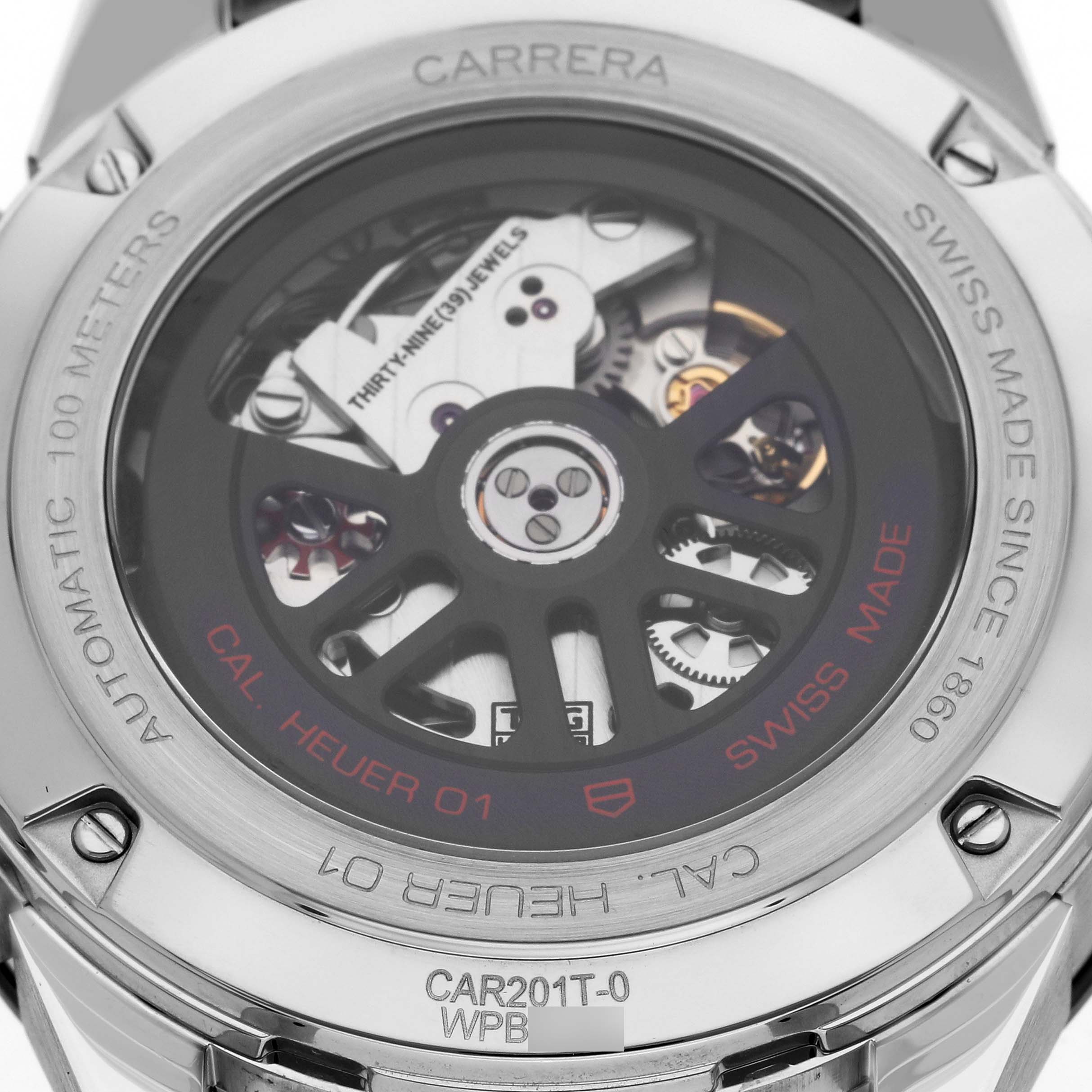 The image shows the back view of a Carrera by Tag Heuer, showcasing the automatic movement and internal mechanics.