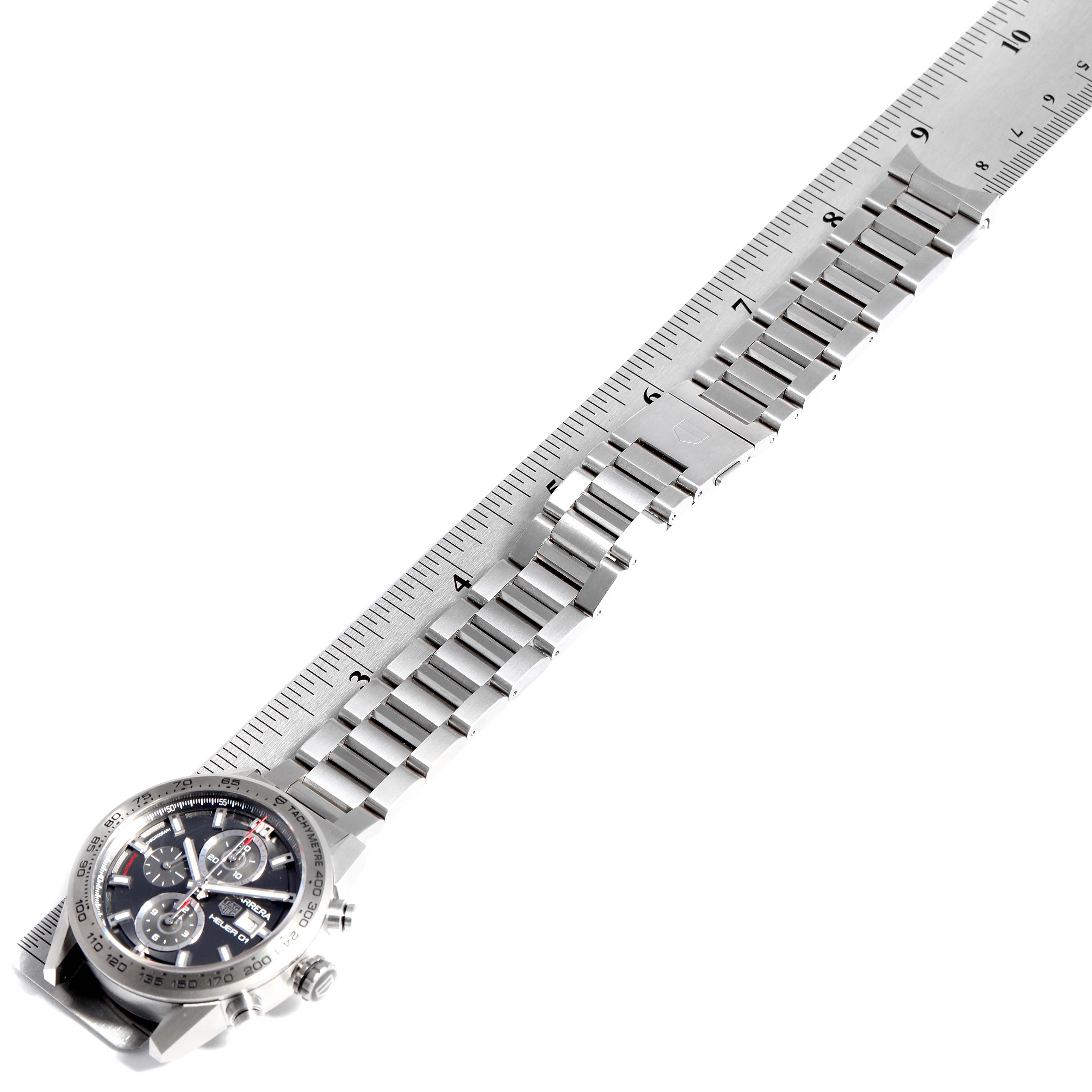 The image shows a Tag Heuer Carrera CAR208Z.BF0719 Men's Titanium Grey Dial CAR208Z.BF0719 Men's Titanium Grey Dial watch laid flat with a ruler to measure its metal bracelet.