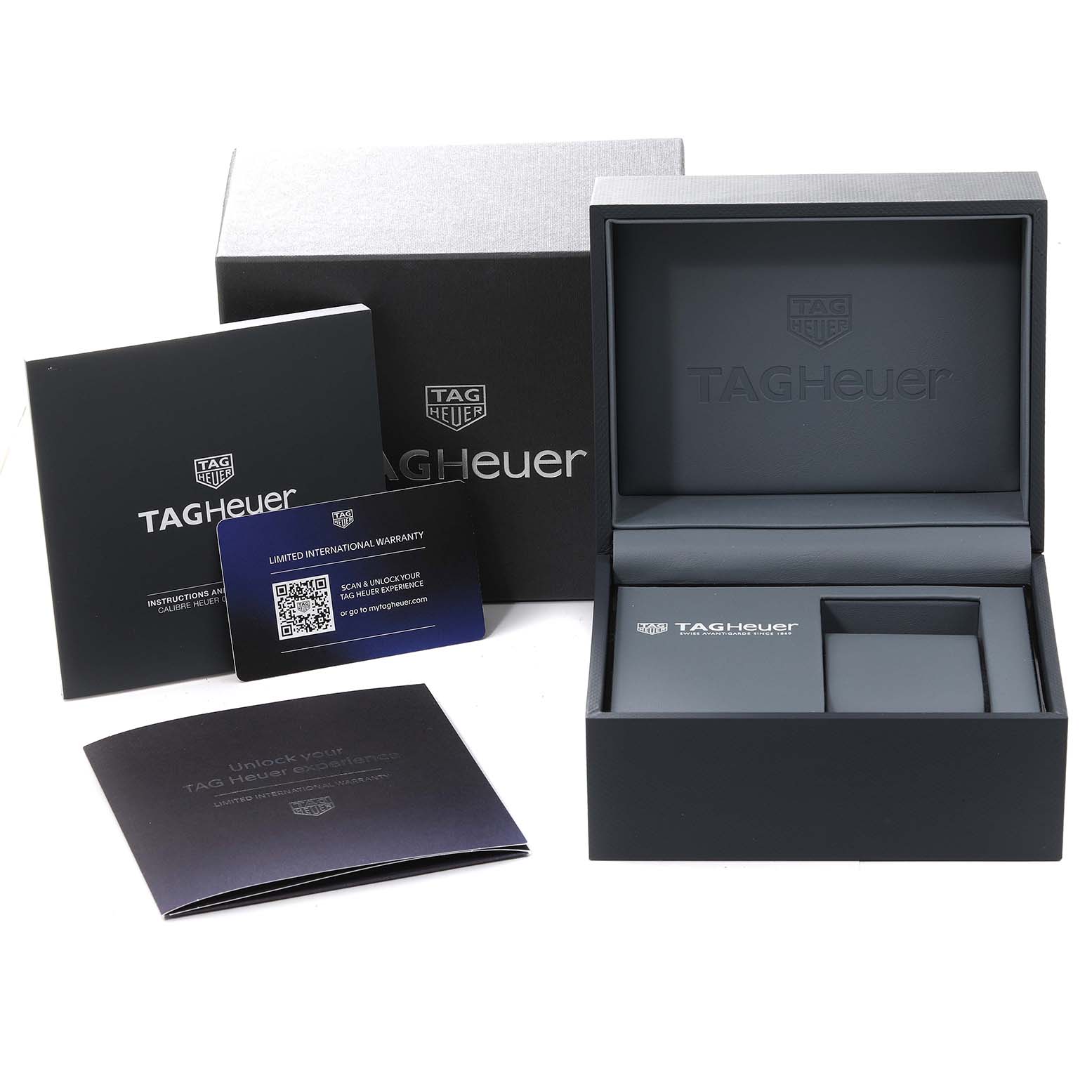 The image shows the box, warranty card, and manuals for the Tag Heuer Monaco CBL2111.FC6453 Men's Stainless Steel Blue Dial CBL2111.FC6453 Men's Stainless Steel Blue Dial watch from a frontal angle.