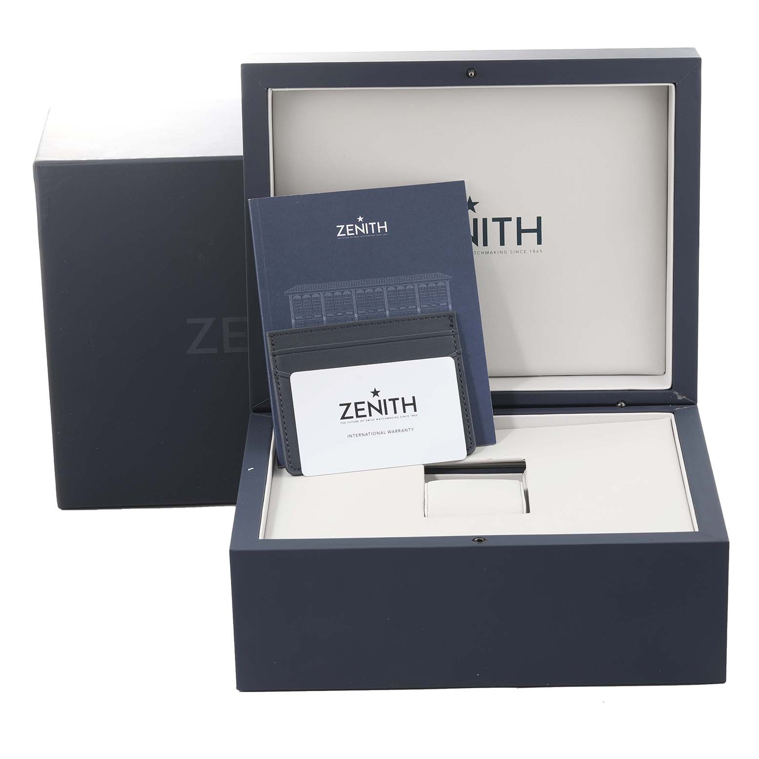 This image shows the packaging and documentation of a Zenith Chronomaster 03.3102.3600/02.M3100 Men's Stainless Steel White Dial 03.3102.3600/02.M3100 Men's Stainless Steel White Dial watch, including the box, warranty card, and booklet.