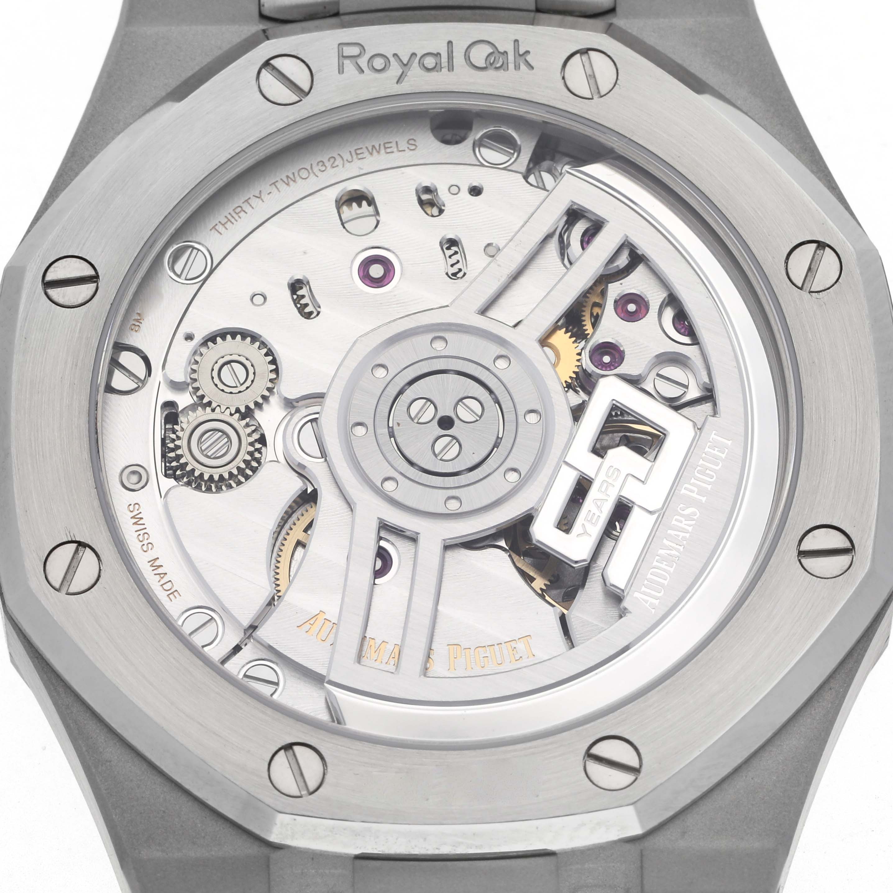 The image shows the back view of a Royal Oak by Audemars Piguet, highlighting the movement and mechanical components.