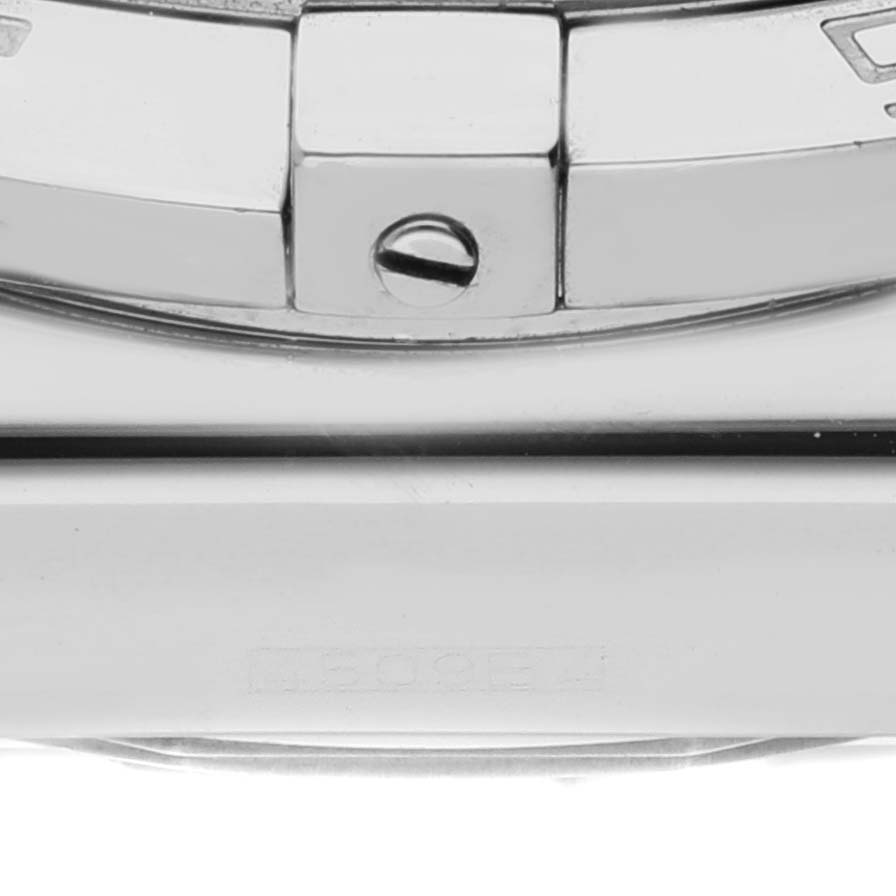 The image shows a close-up of the bezel and case of a Breitling Chronomat AB0110 Men
s Stainless Steel Black Dial AB0110 Men
s Stainless Steel Black Dial watch, highlighting the screw and one of the bezel markers.