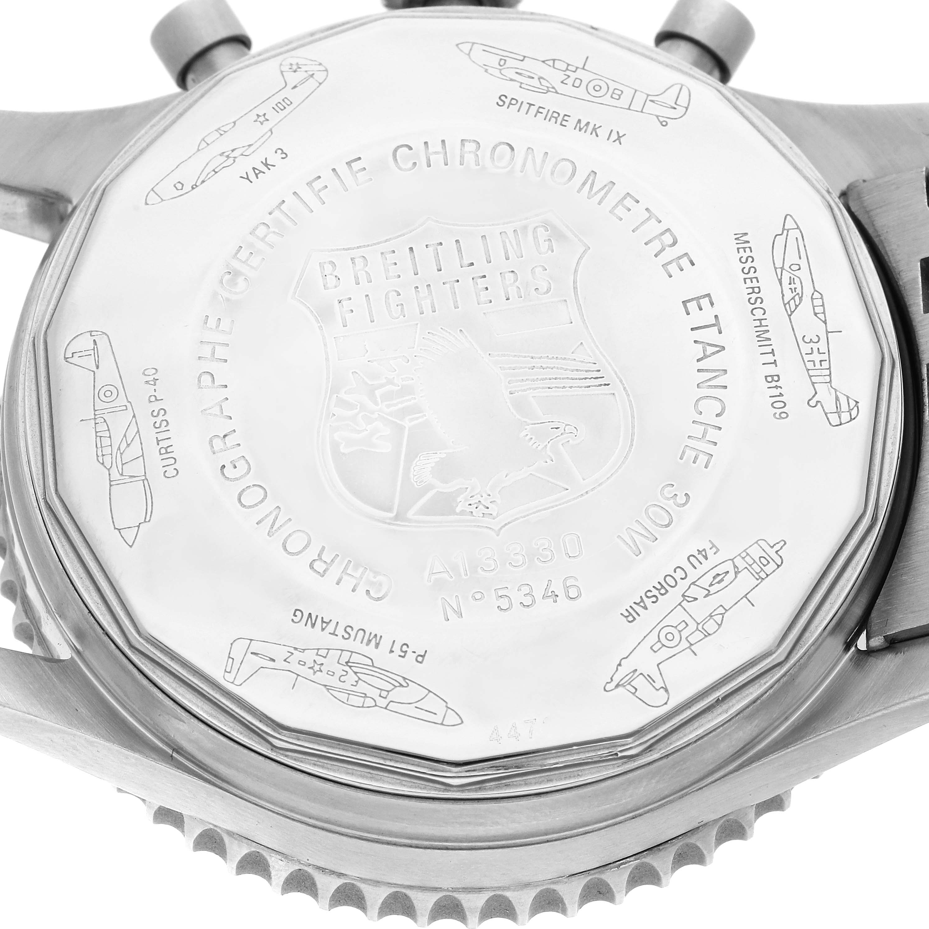 The image shows the back case of a Breitling Navitimer A13330 Men
s Stainless Steel Black Dial A13330 Men
s Stainless Steel Black Dial watch, featuring engraved aircraft designs and model details.
