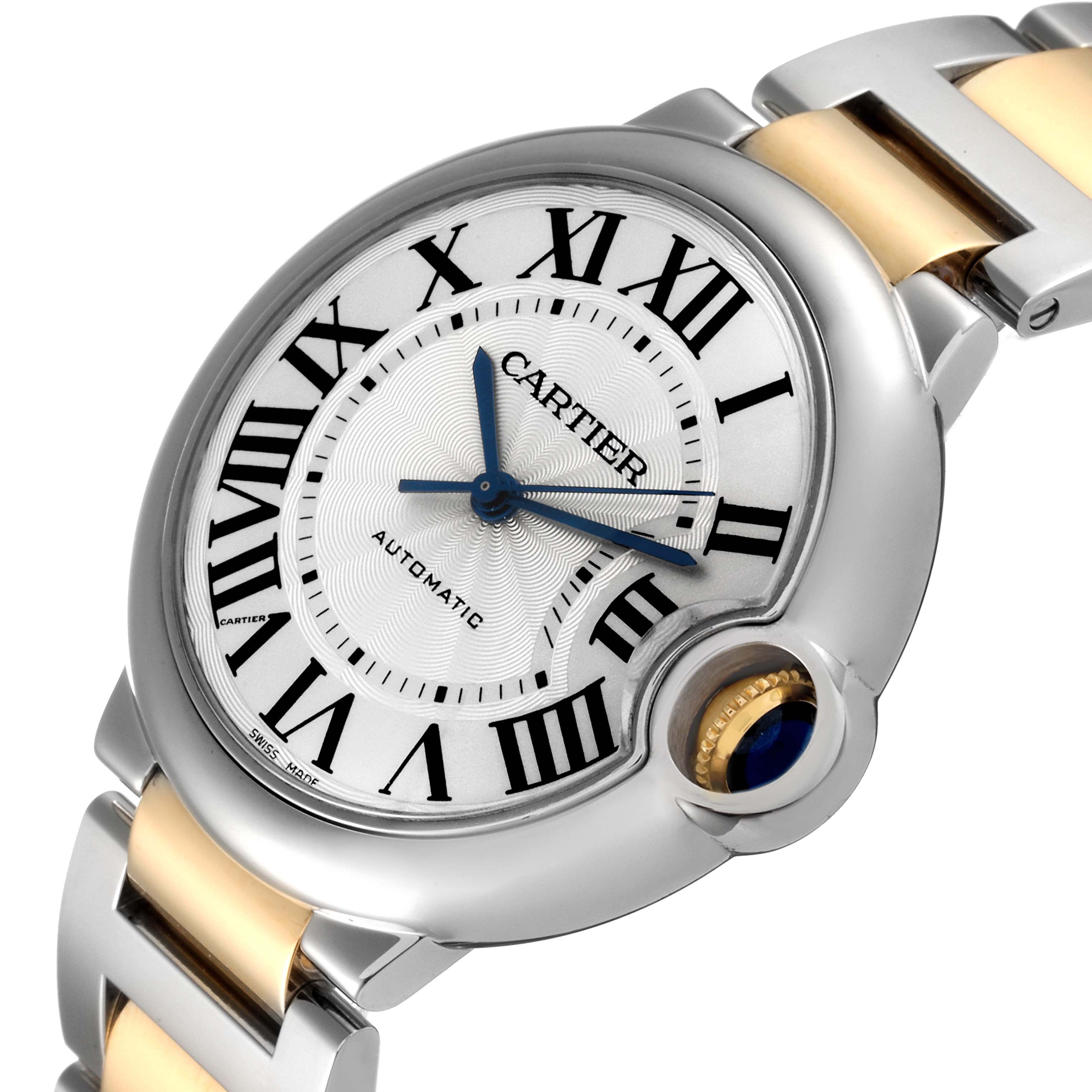 This image shows a close-up angled view of the Cartier Ballon Bleu W2BB0012 Women
s Steel and Gold (two tone) Silver Dial W2BB0012 Women
s Steel and Gold (two tone) Silver Dial watch, displaying its face, crown, and part of the strap.