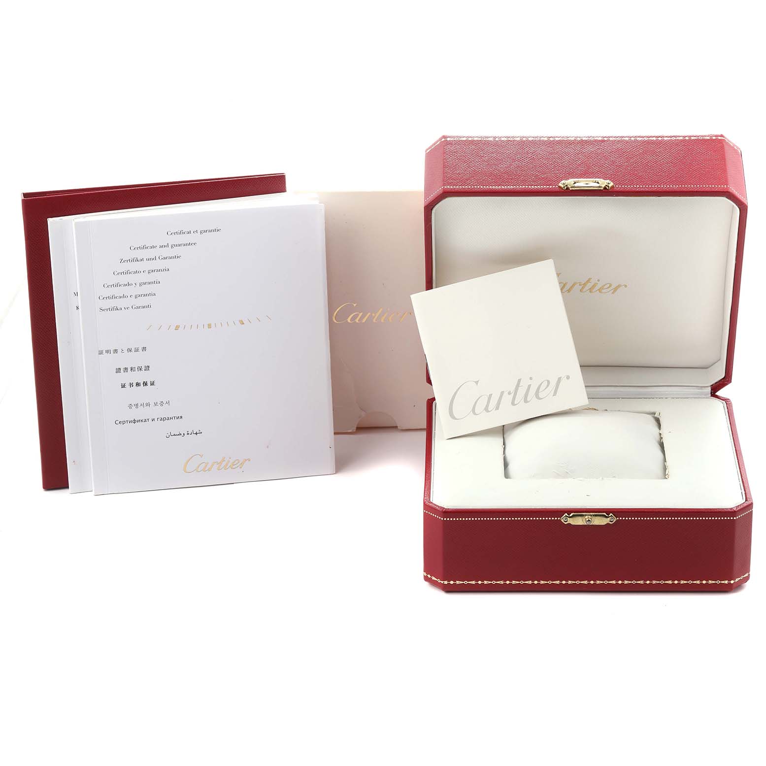 The image shows the open box, pillow, warranty, and booklet for the Calibre de Cartier watch by Cartier.