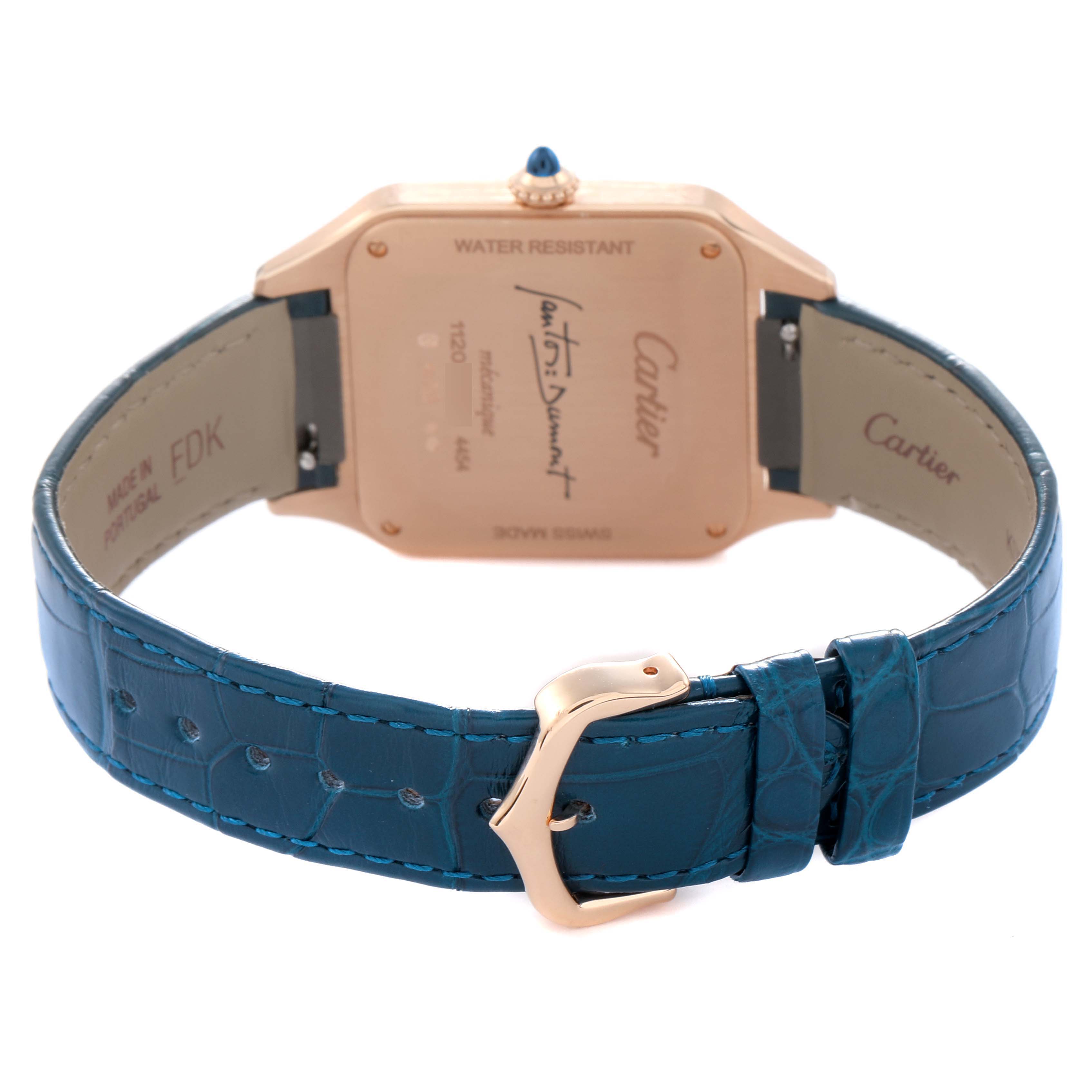 The Santos Dumont by Cartier is shown from the back, highlighting the case back and blue leather strap with a buckle.