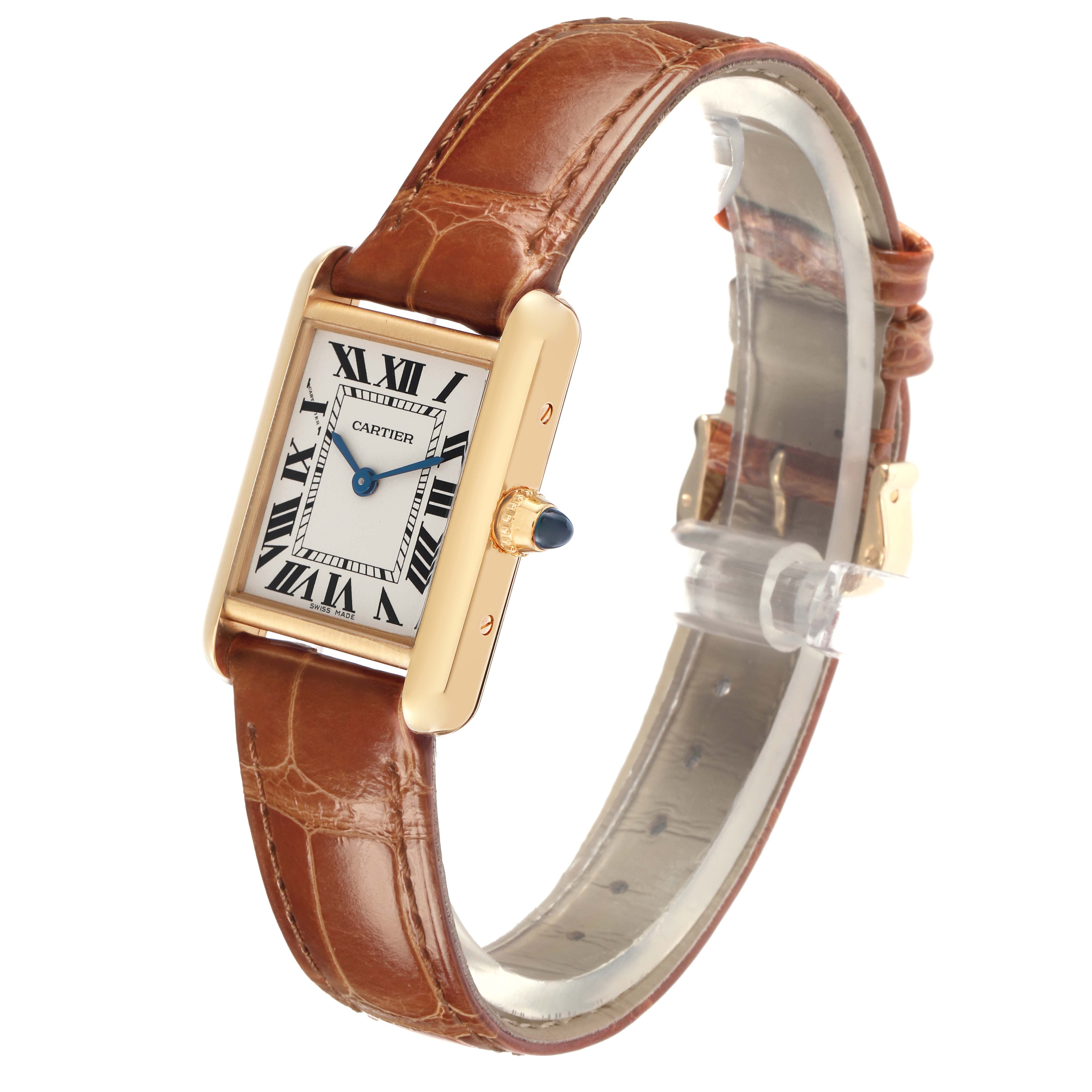 The Cartier Tank Louis W1529856 Women
s Yellow Gold Silver Dial W1529856 Women
s Yellow Gold Silver Dial watch is shown at an angle highlighting its rectangular face, roman numeral dial, and leather strap.