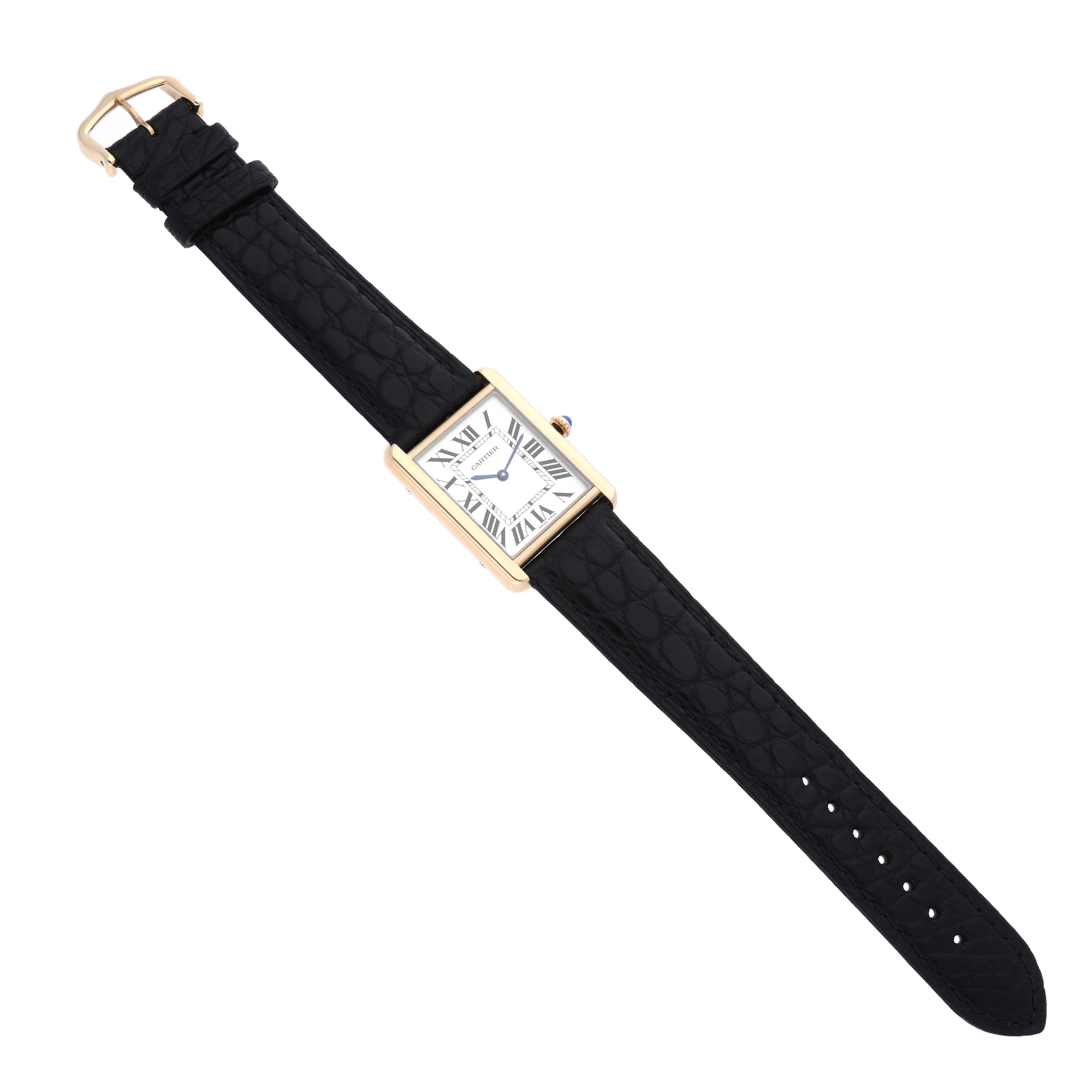 The Cartier Tank Solo W1018855 Men's Steel and Gold (two tone) Silver Dial W1018855 Men's Steel and Gold (two tone) Silver Dial watch is displayed fully extended, showing the face, strap, and buckle from a top-down angle.