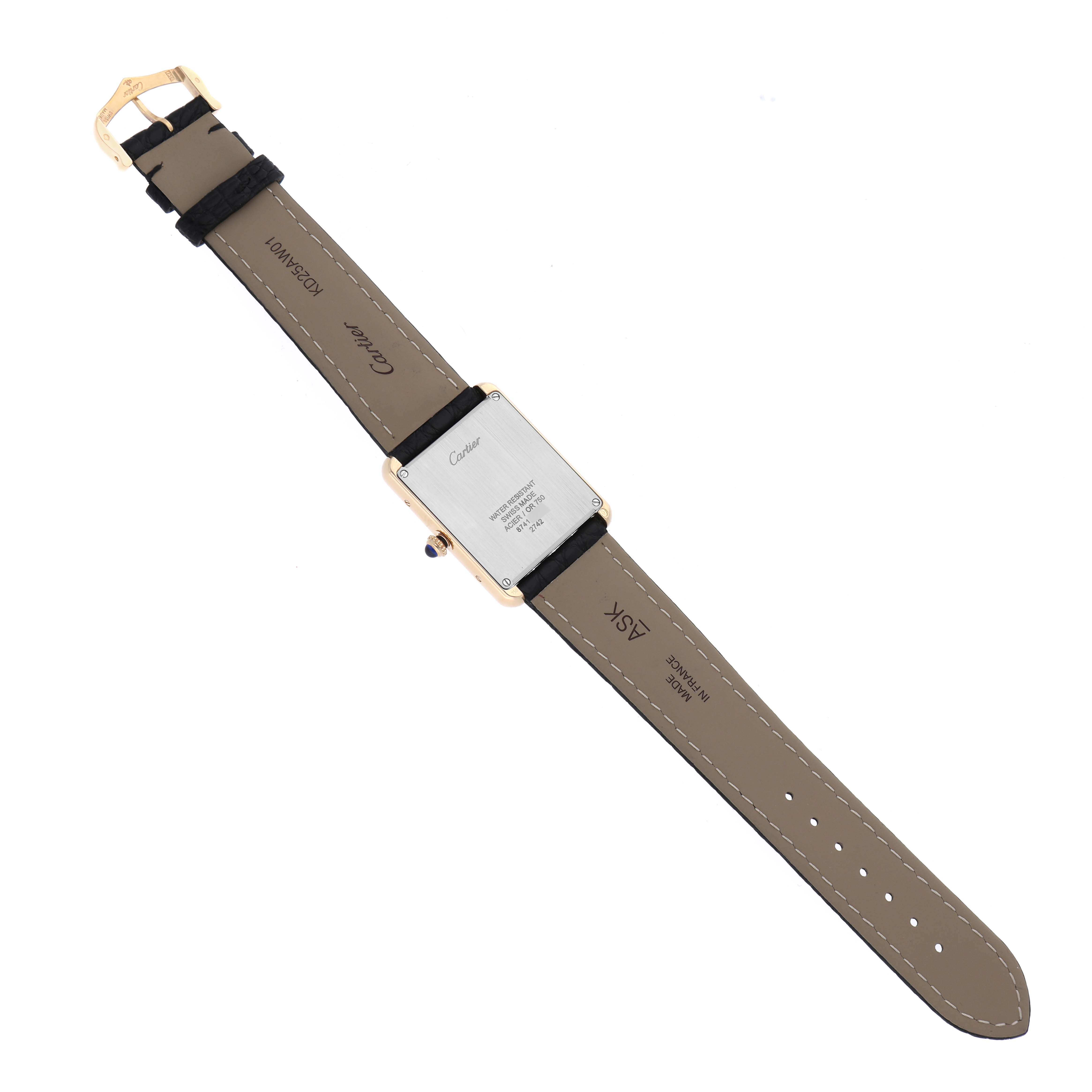 The image shows the back view of a Cartier Tank Solo W1018855 Men's Steel and Gold (two tone) Silver Dial W1018855 Men's Steel and Gold (two tone) Silver Dial watch, displaying its leather strap, buckle, and case back.