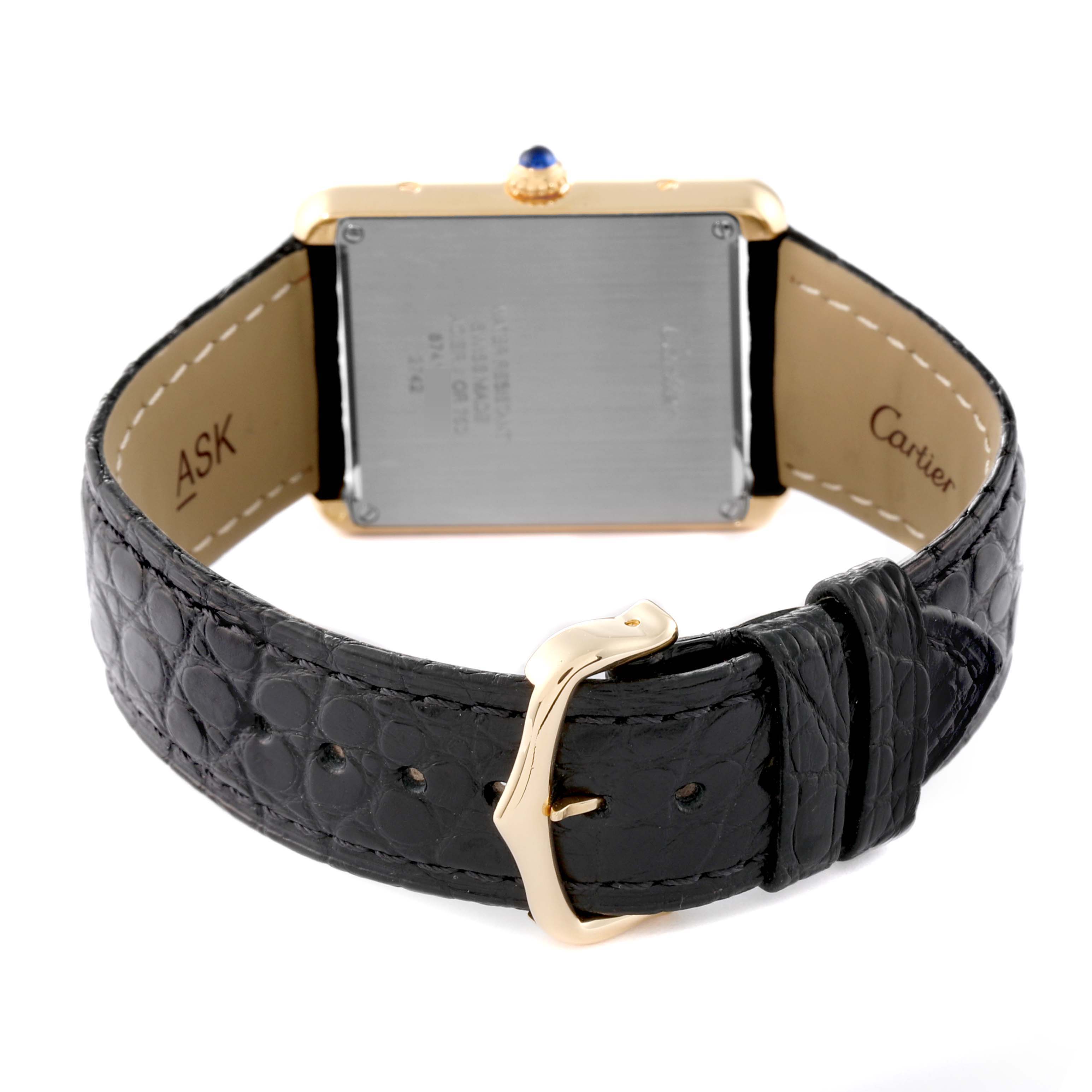 The image shows the back view of a Cartier Tank Solo W1018855 Men's Steel and Gold (two tone) Silver Dial W1018855 Men's Steel and Gold (two tone) Silver Dial watch, highlighting its black strap, gold buckle, and case back.