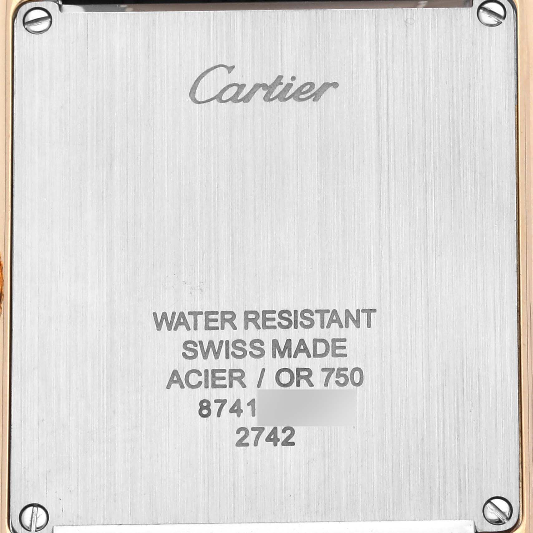This image shows the back case of a Cartier Tank Solo W1018855 Men's Steel and Gold (two tone) Silver Dial W1018855 Men's Steel and Gold (two tone) Silver Dial watch, displaying brand and specifications.
