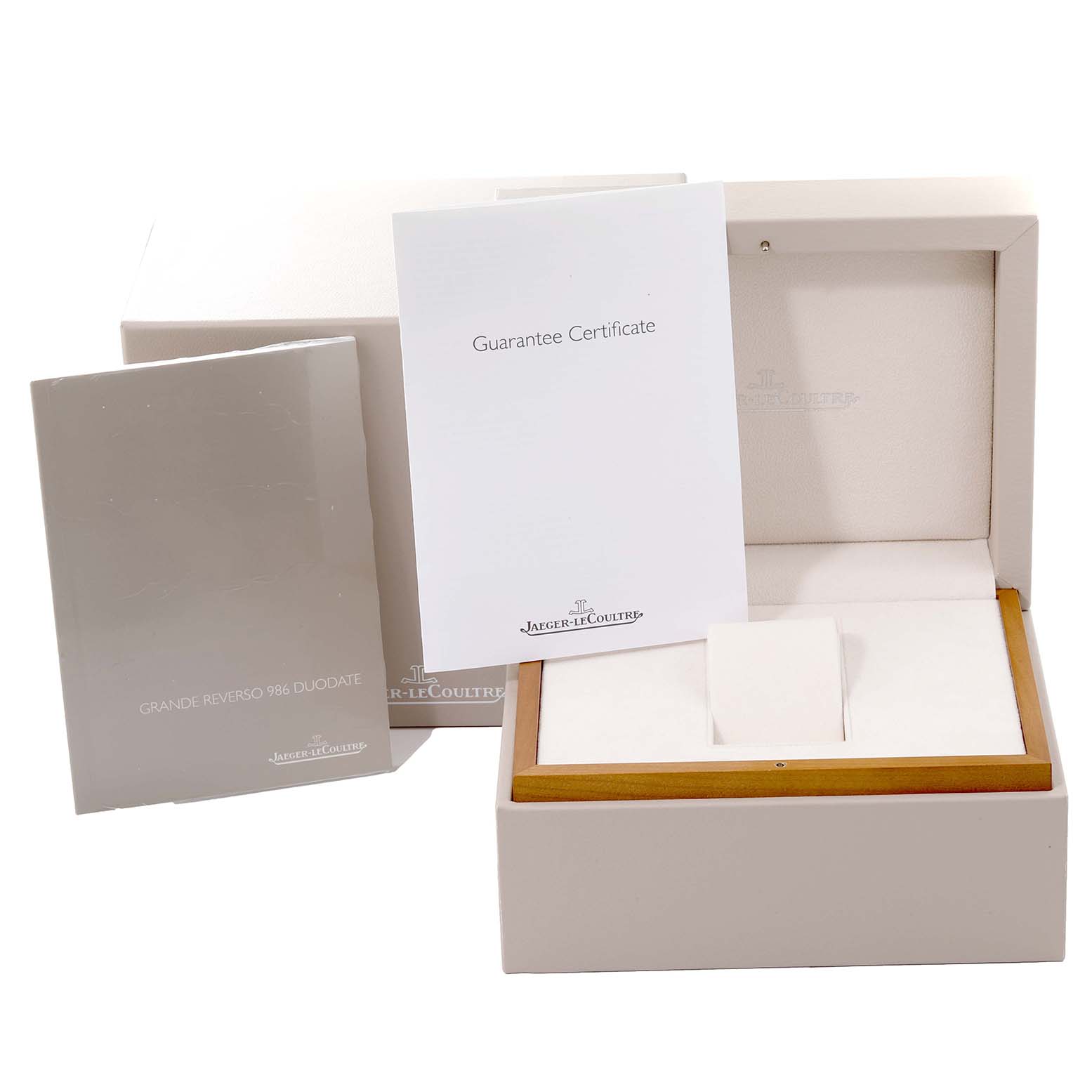 The image shows an open box and documentation for the Jaeger LeCoultre Reverso Q3748421 Men's Stainless Steel Silver Dial Q3748421 Men's Stainless Steel Silver Dial model, including a guarantee certificate and user manual.
