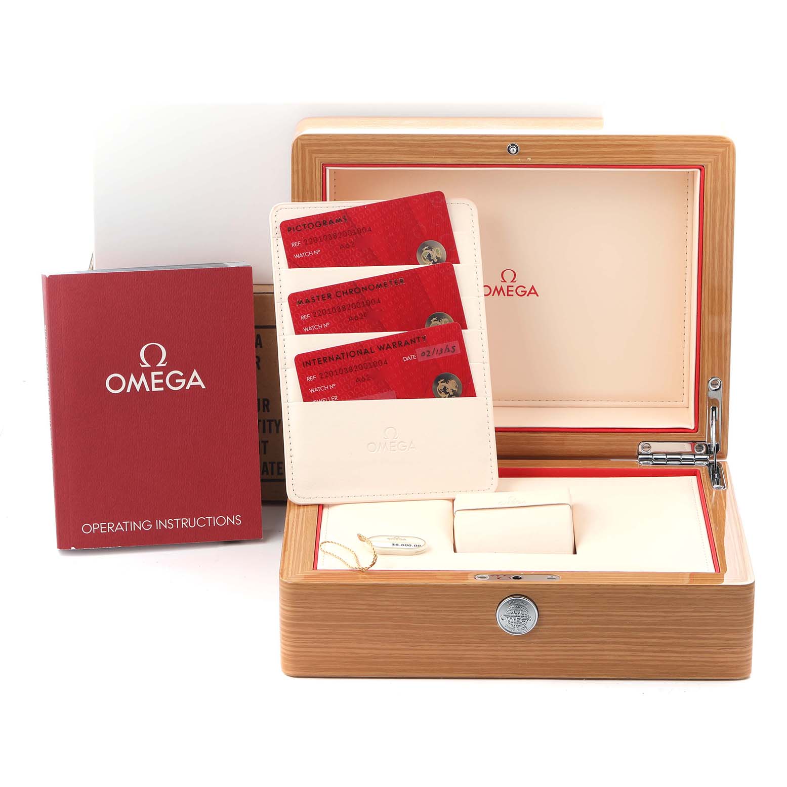 The image shows the Omega Aqua Terra 220.10.38.20.01.004 Men
s Stainless Steel Black Dial 220.10.38.20.01.004 Men
s Stainless Steel Black Dial watch box, manuals, and cards from a top angle.