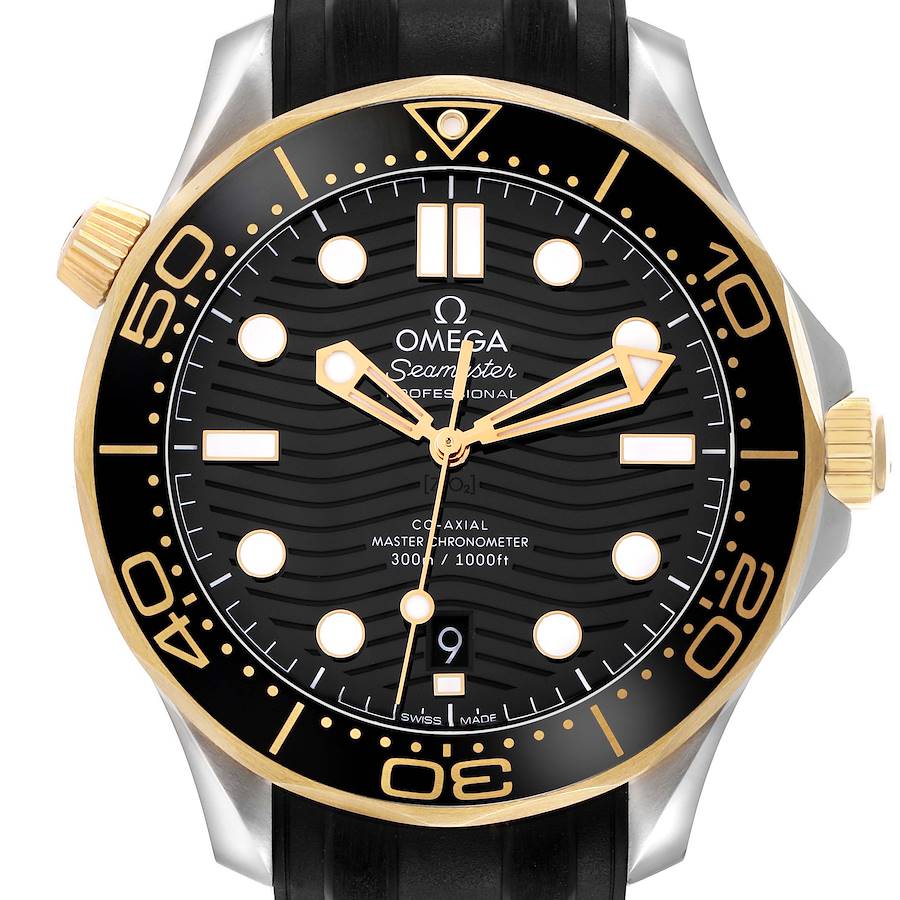 The Omega Seamaster watch is shown from a front angle, highlighting its black dial, gold bezel, and hands.
