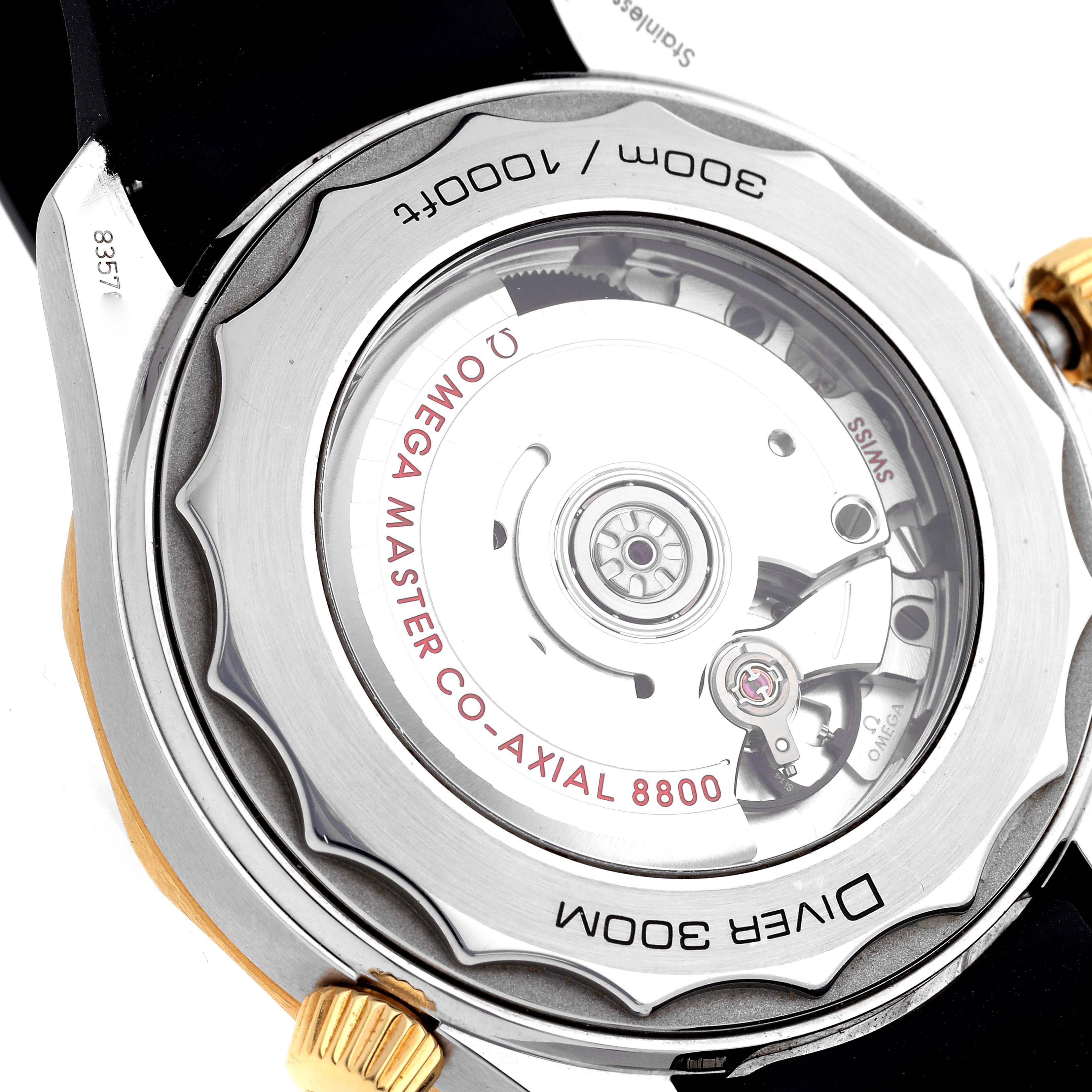 The image shows the case back of an Omega Seamaster 210.22.42.20.01.001 Men
s Steel and Gold (two tone) Black Dial 210.22.42.20.01.001 Men
s Steel and Gold (two tone) Black Dial, highlighting the movement and "CO-AXIAL 8800" text.