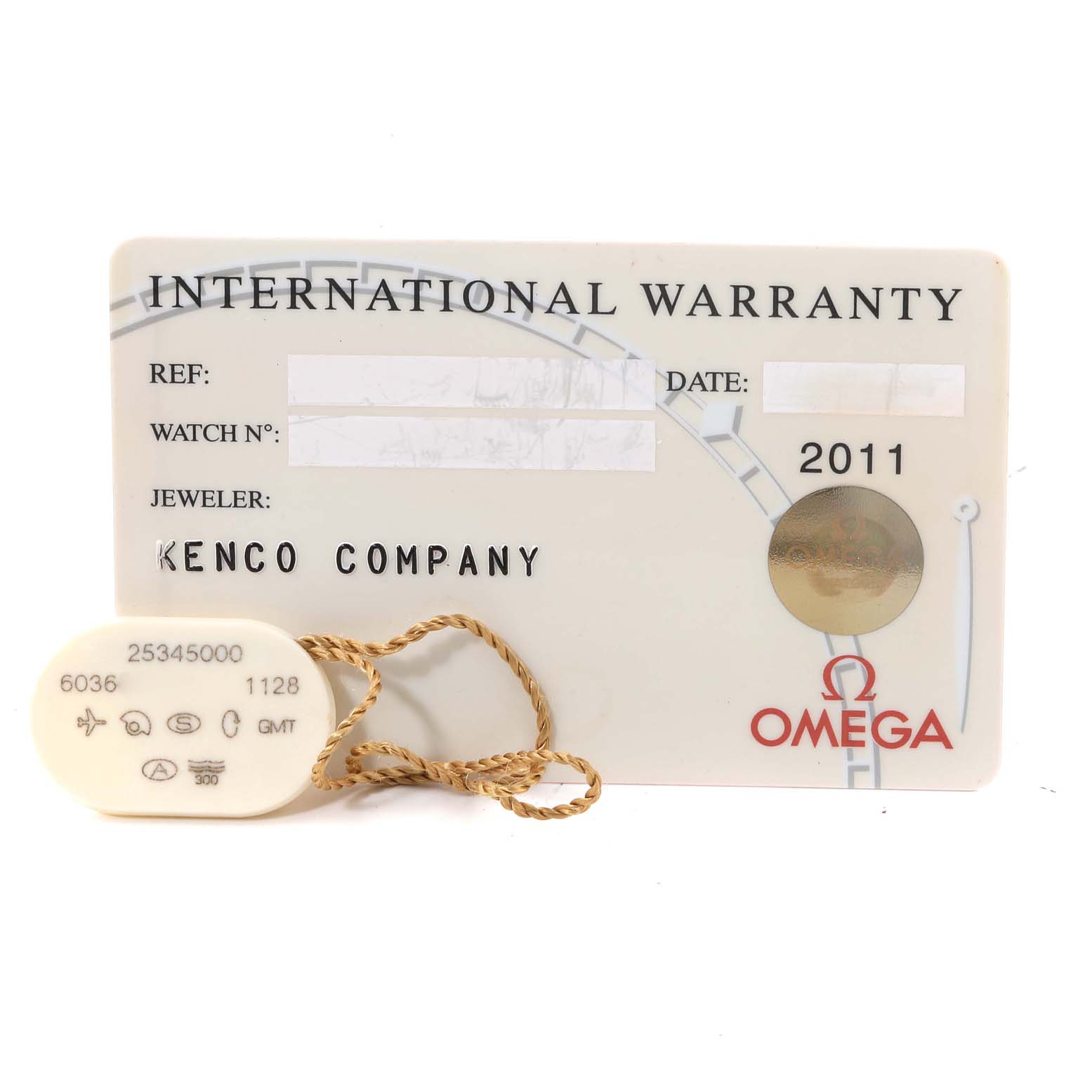 The image shows an Omega International Warranty card and a tag for the Seamaster model.