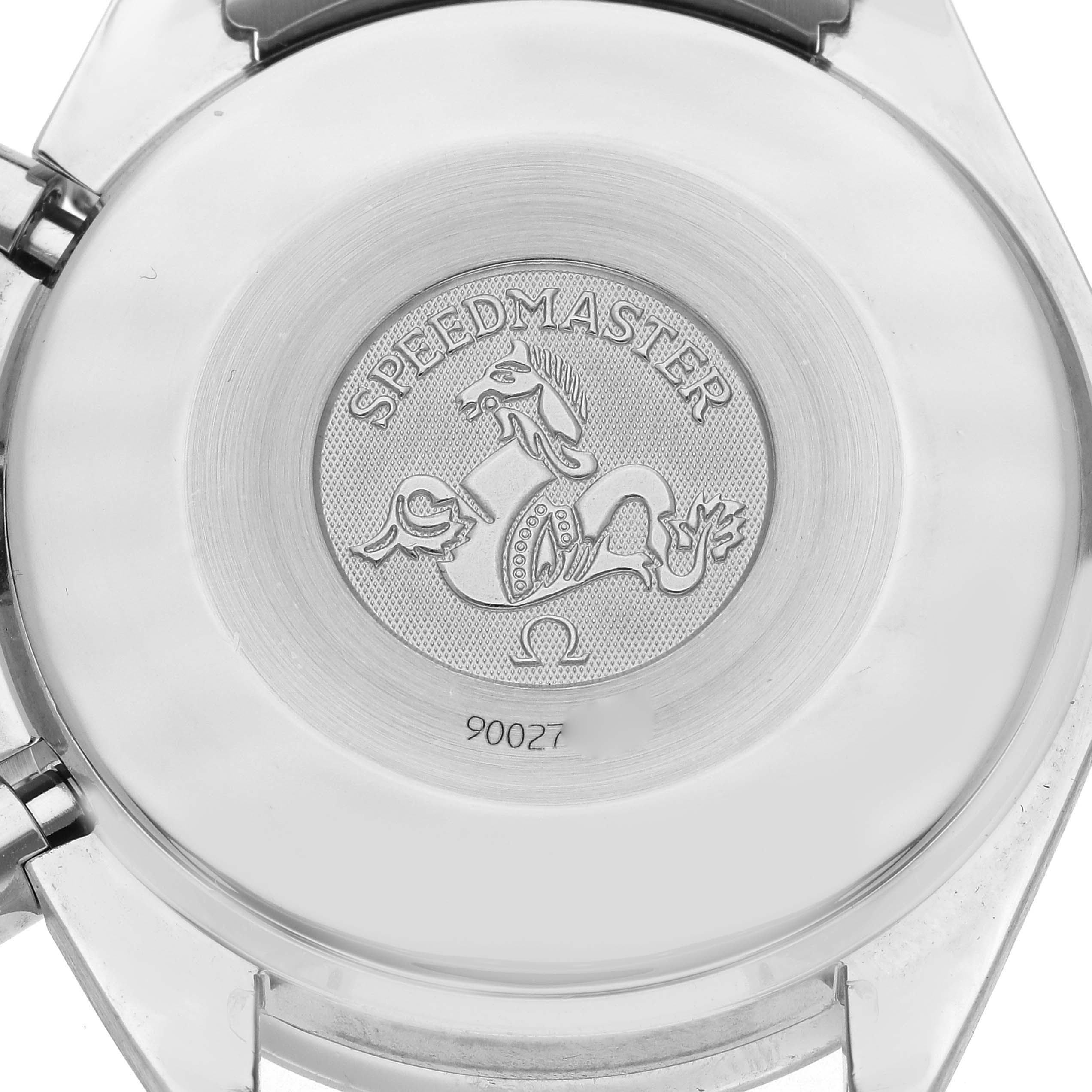 The image shows the case back of an Omega Speedmaster 3515.79.00 Men
s Stainless Steel Mother of Pearl Dial 3515.79.00 Men
s Stainless Steel Mother of Pearl Dial watch, featuring an engraved logo and text.