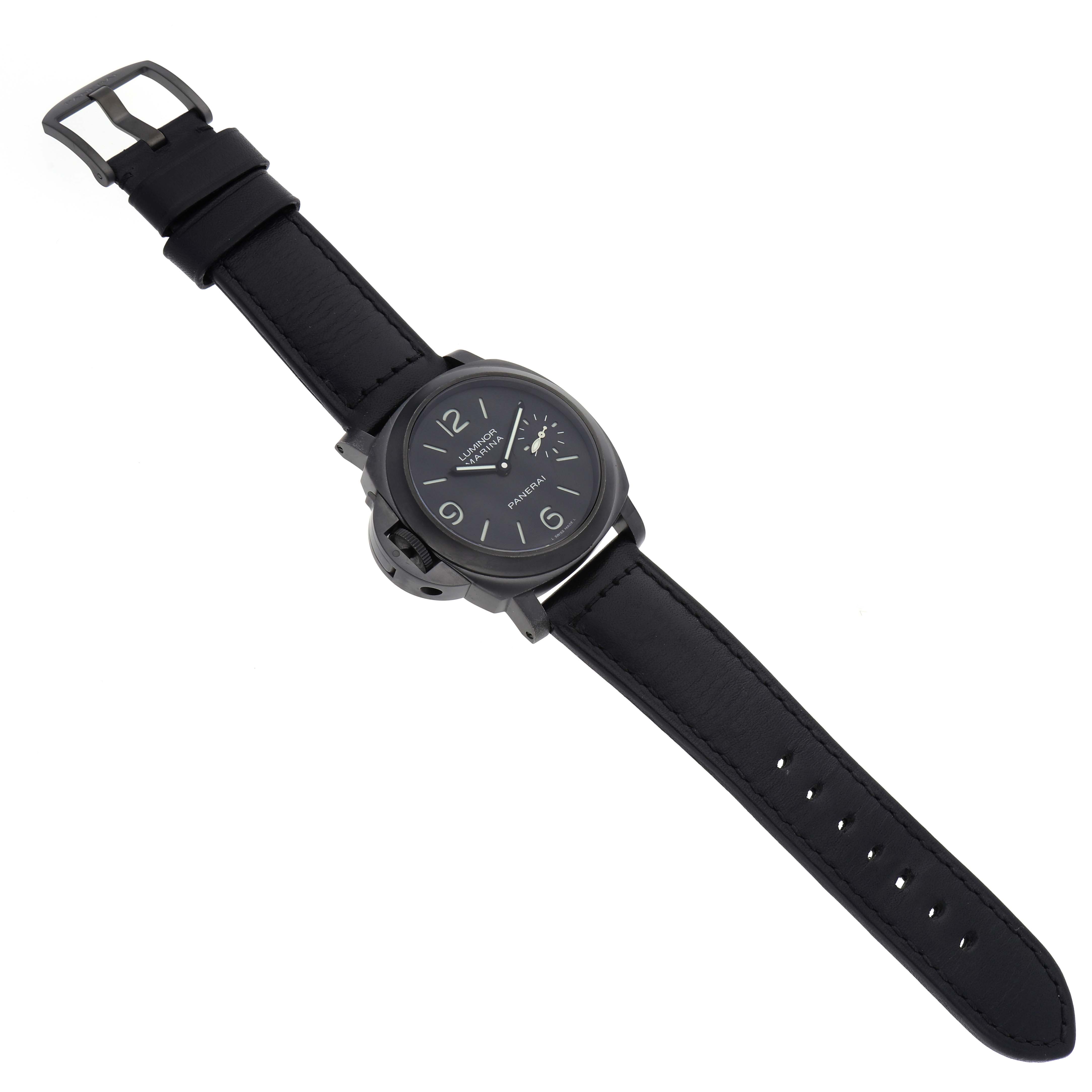 The Panerai Luminor PAM00026 Men's Stainless Steel Black Dial PAM00026 Men's Stainless Steel Black Dial watch is shown from a top-down angle, highlighting its face, crown guard, and leather strap.