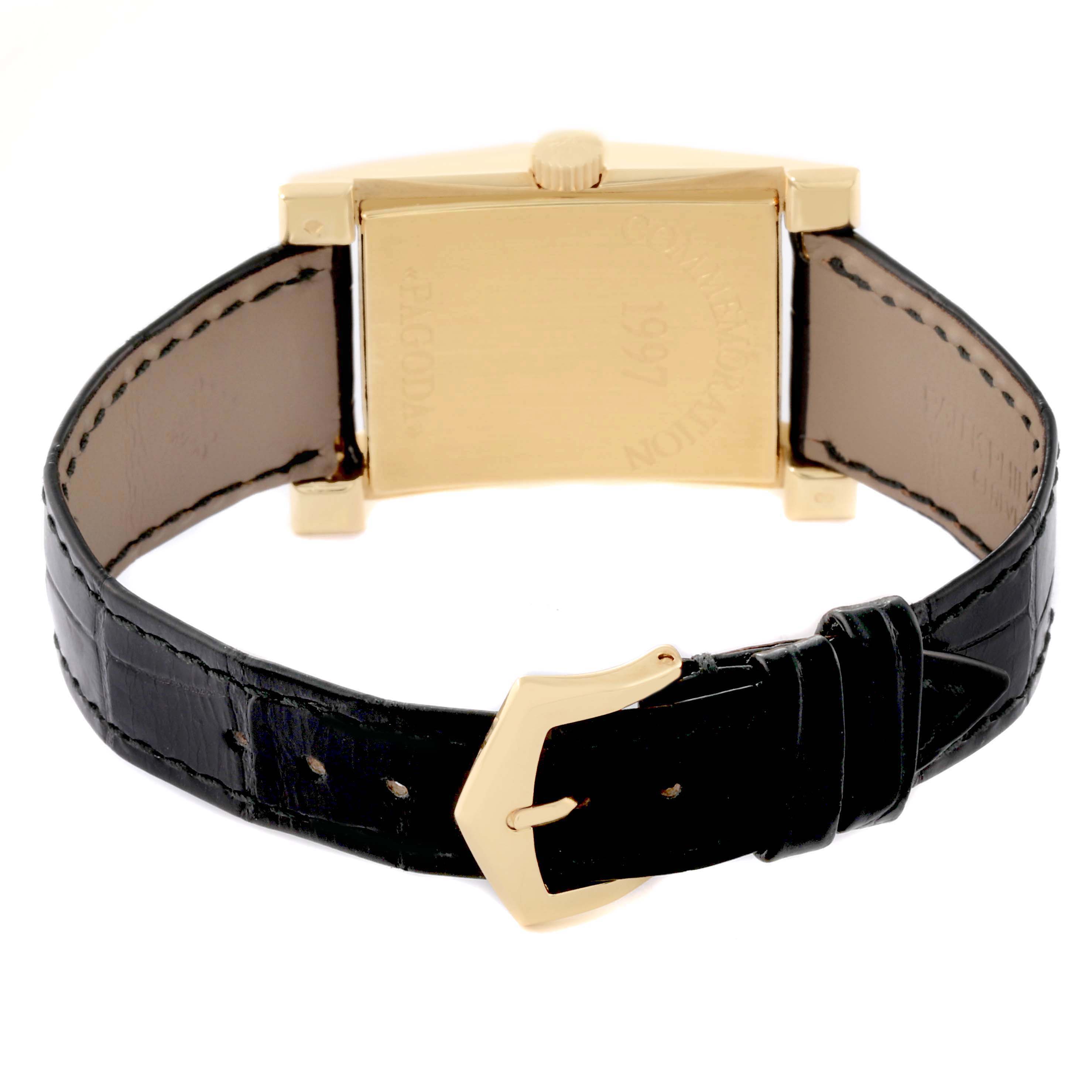 The image shows the back view of the Patek Philippe Pagoda 5500J Men's Yellow Gold Champagne Dial watch, featuring the case, crown, and leather strap with a buckle.