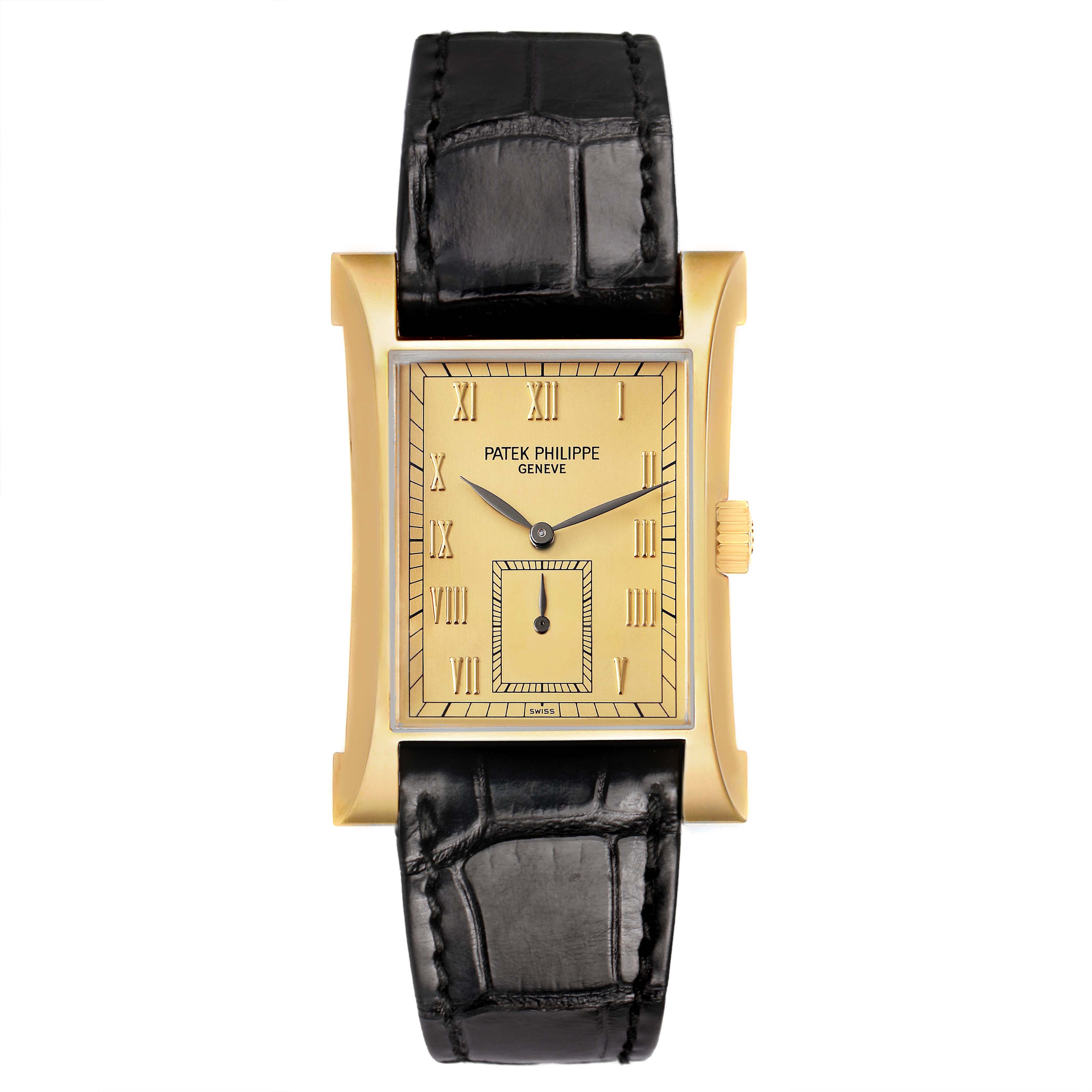 The Patek Philippe Pagoda 5500J Men's Yellow Gold Champagne Dial watch is shown from a front angle, highlighting the rectangular gold case, black strap, and Roman numeral dial.