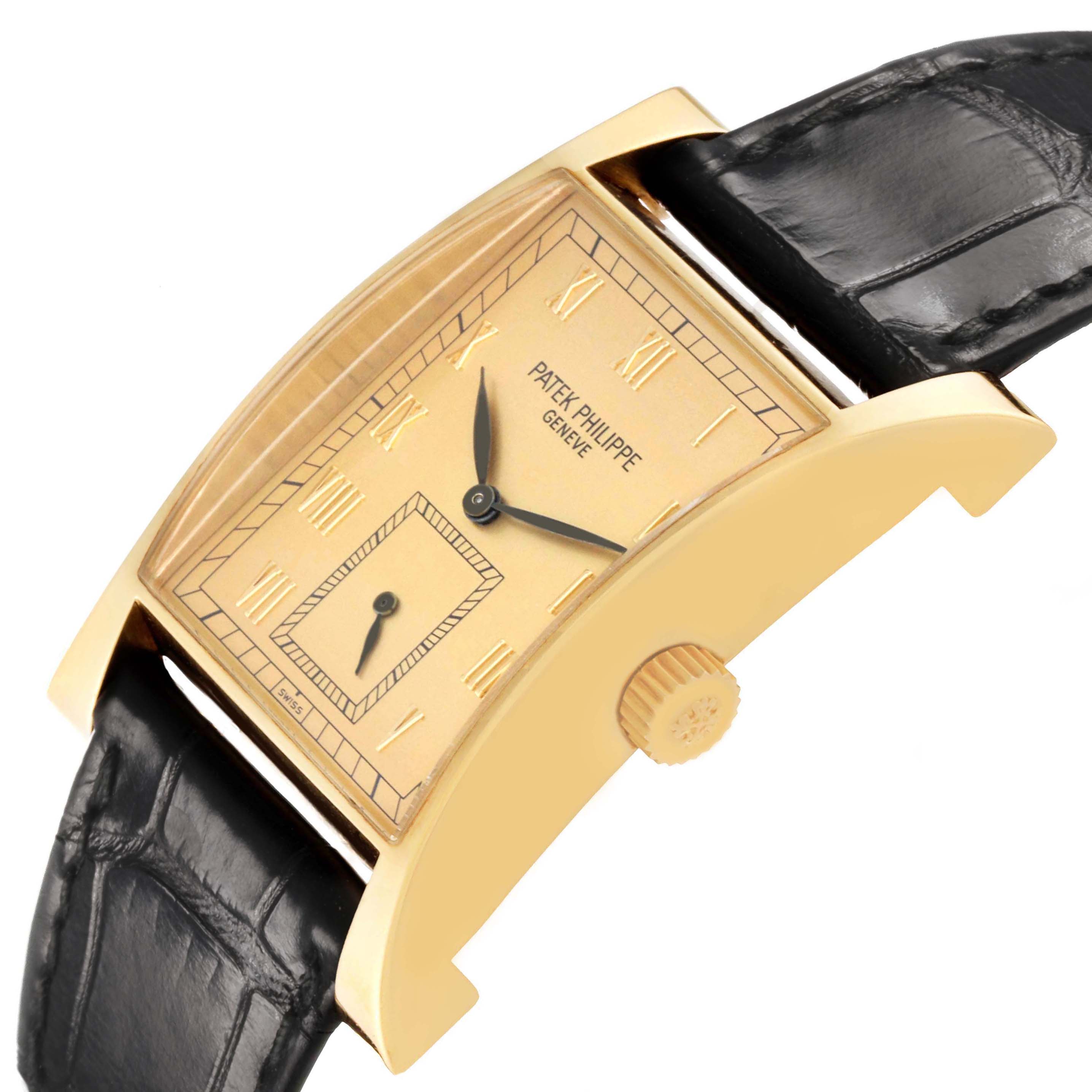 The Patek Philippe Pagoda 5500J Men's Yellow Gold Champagne Dial watch is shown at an angled side view, highlighting the dial, case, crown, and leather strap.