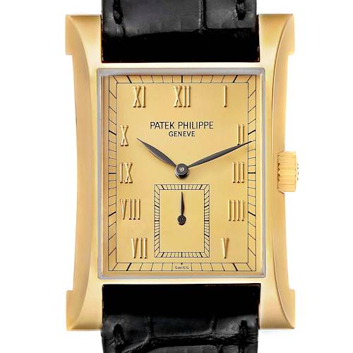 The Patek Philippe Pagoda 5500J Men's Yellow Gold Champagne Dial watch is shown from a top-down angle, highlighting its rectangular face, gold-tone case, and black strap.