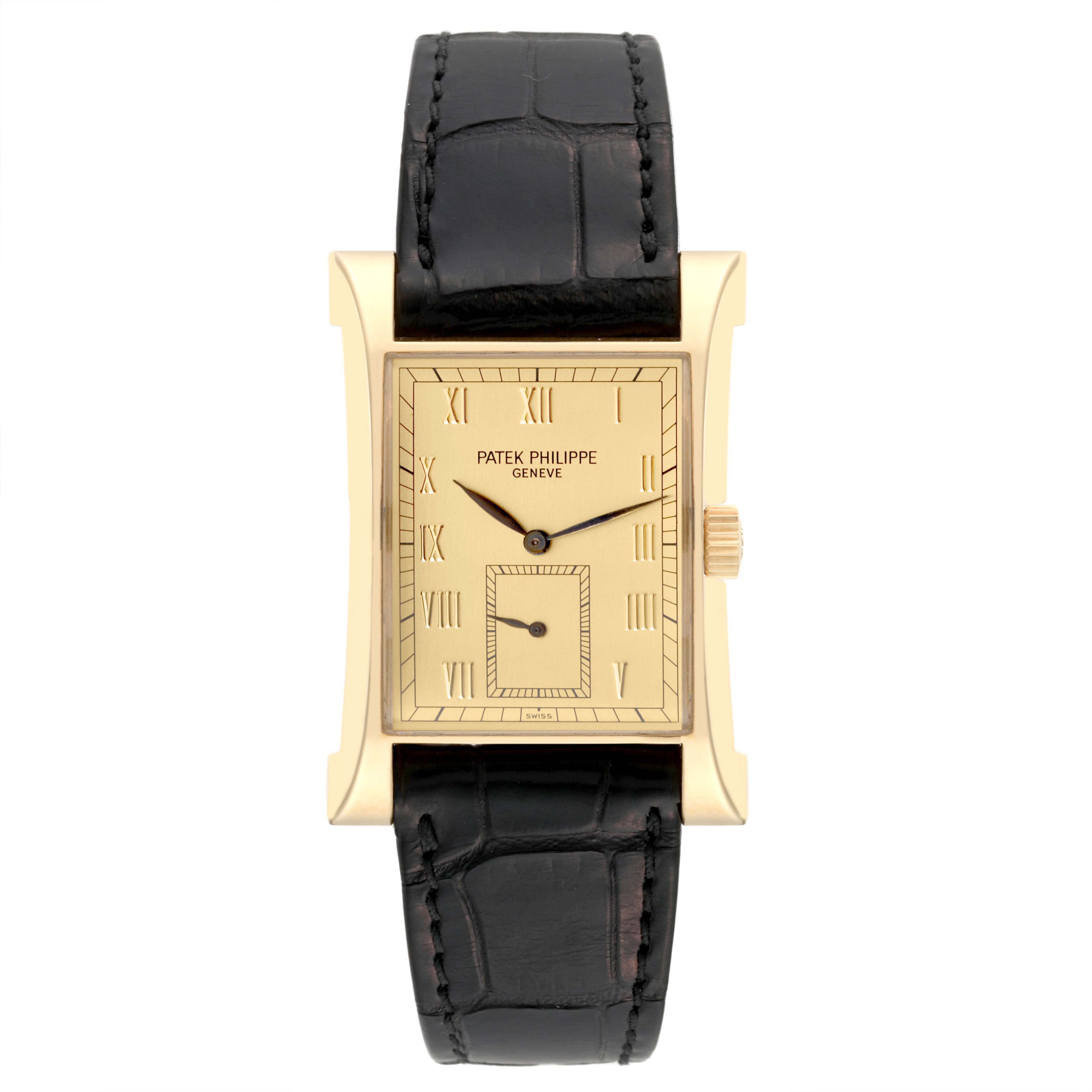 The Patek Philippe Pagoda 5500J Men's Yellow Gold Champagne Dial 5500J Men's Yellow Gold Champagne Dial watch is shown from a front angle, displaying its rectangular face, black leather strap, and gold case.