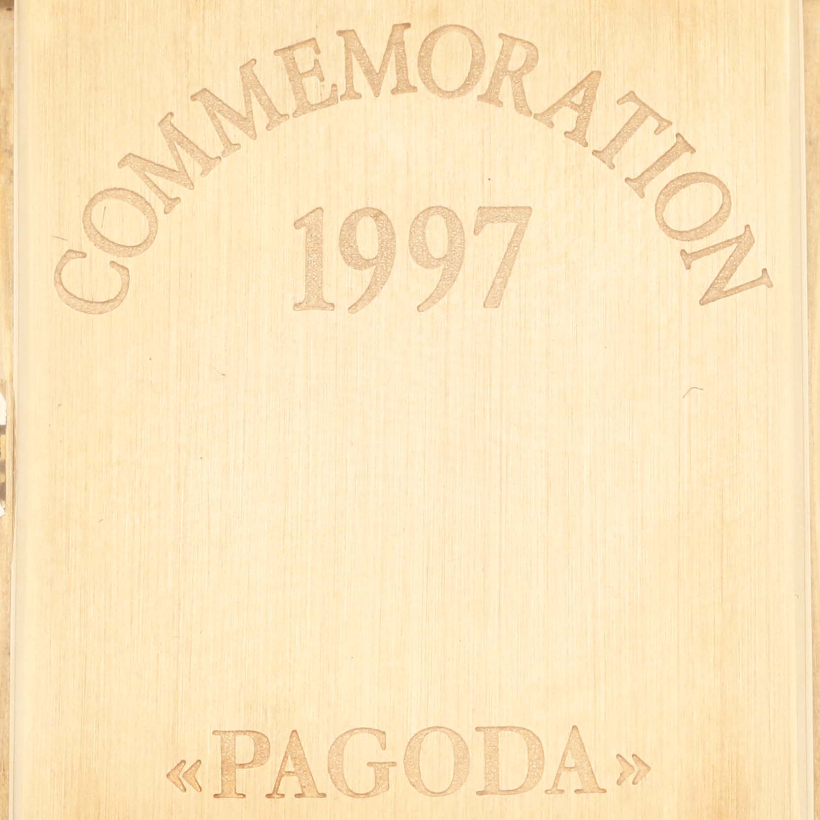 This image shows the engraved wooden box lid commemorating the 1997 release of the Patek Philippe Pagoda 5500J Men's Yellow Gold Champagne Dial 5500J Men's Yellow Gold Champagne Dial watch.