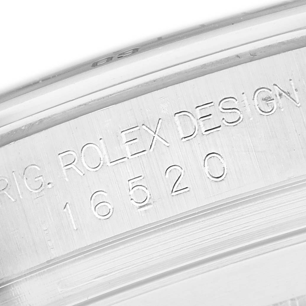 The image shows a close-up of the inner case engraving on a Rolex Daytona 16520 Men
s Stainless Steel White Dial 16520 Men
s Stainless Steel White Dial, displaying the model number 16520.