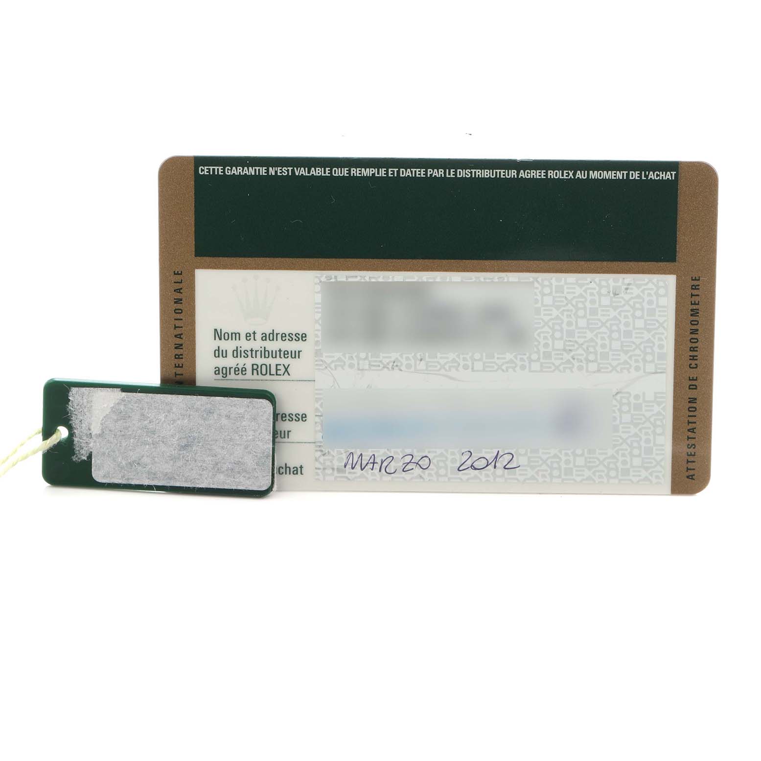 The image shows a warranty card and a tag for a Rolex Daytona 116518 Men
s Yellow Gold Blue Dial 116518 Men
s Yellow Gold Blue Dial watch, viewed from the front.