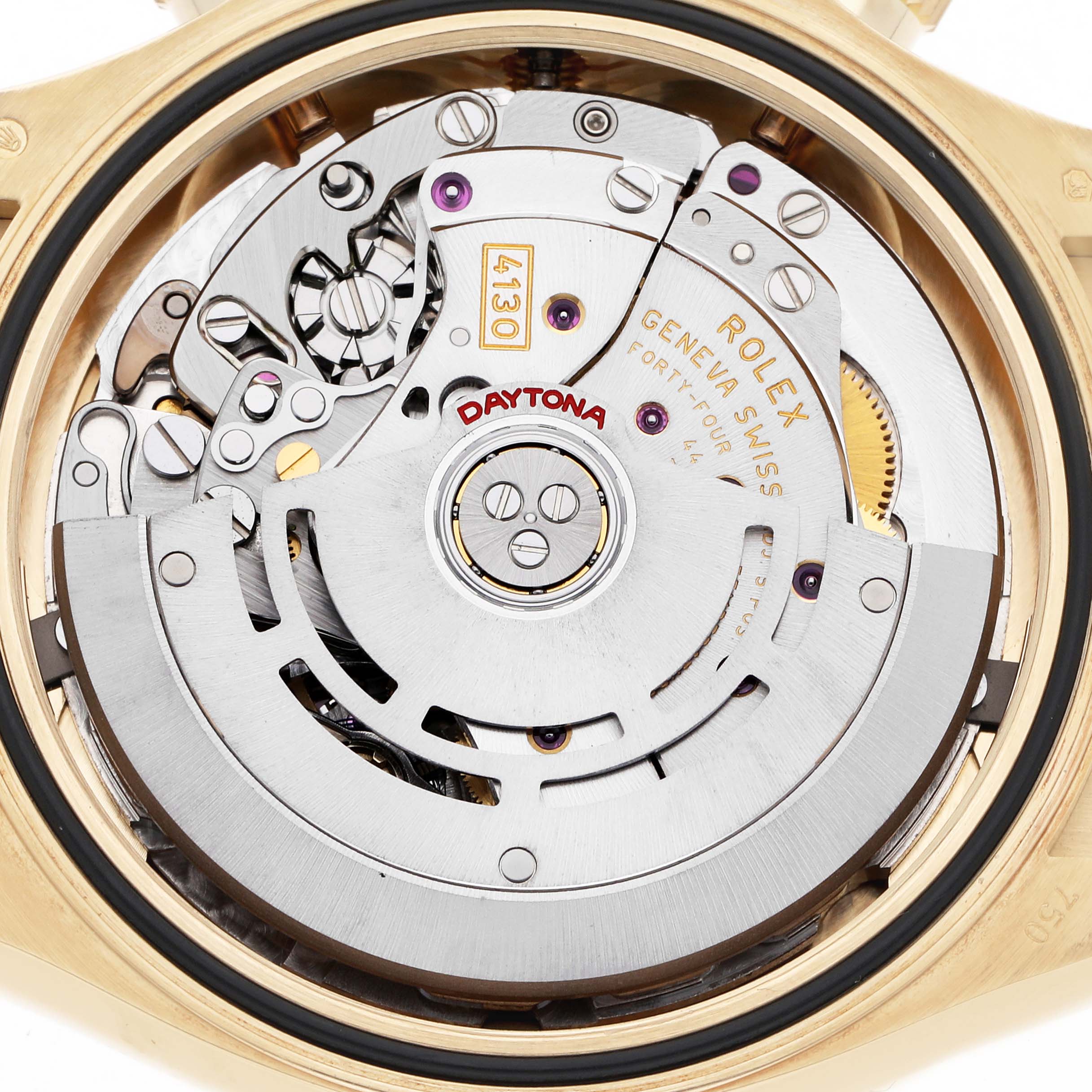 The image shows the movement of a Rolex Daytona 116518 Men
s Yellow Gold Blue Dial 116518 Men
s Yellow Gold Blue Dial watch from a top-down angle, highlighting its intricate mechanical parts.