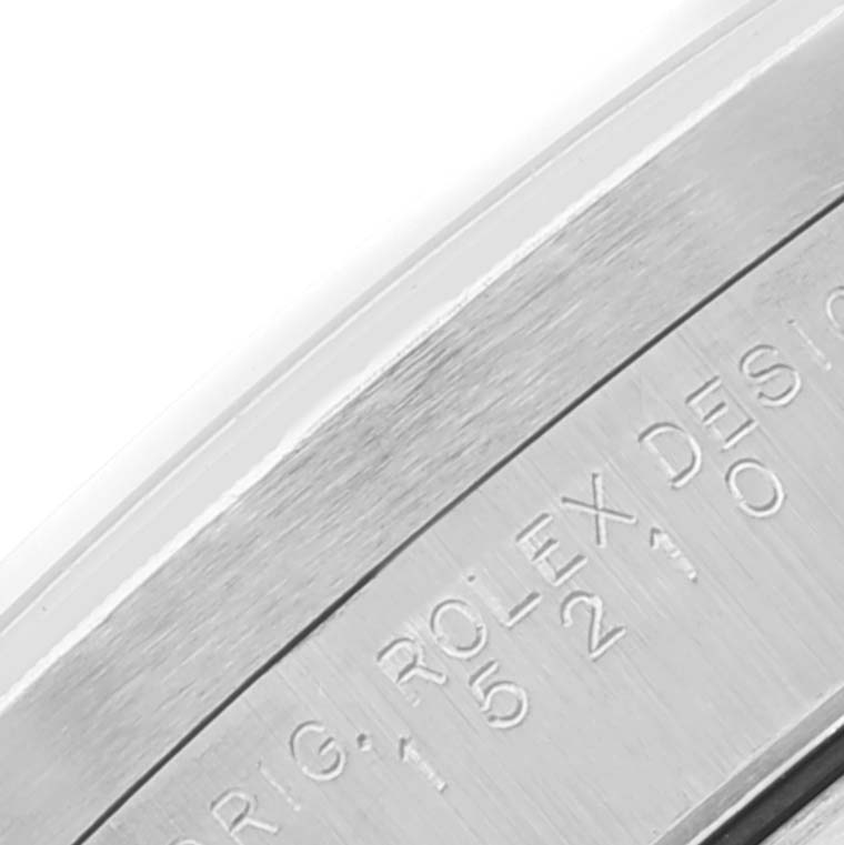 This close-up image shows the engravings on the case of a Rolex Date 15210 Men's Stainless Steel Pink Dial 15210 Men's Stainless Steel Pink Dial model watch.