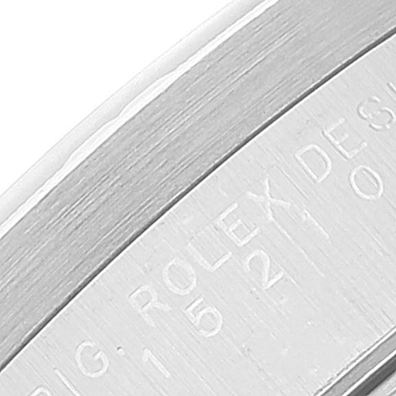 This image shows a close-up of the engraved side of a Rolex Date 15210 Men's Stainless Steel Silver Dial 15210 Men's Stainless Steel Silver Dial model watch.