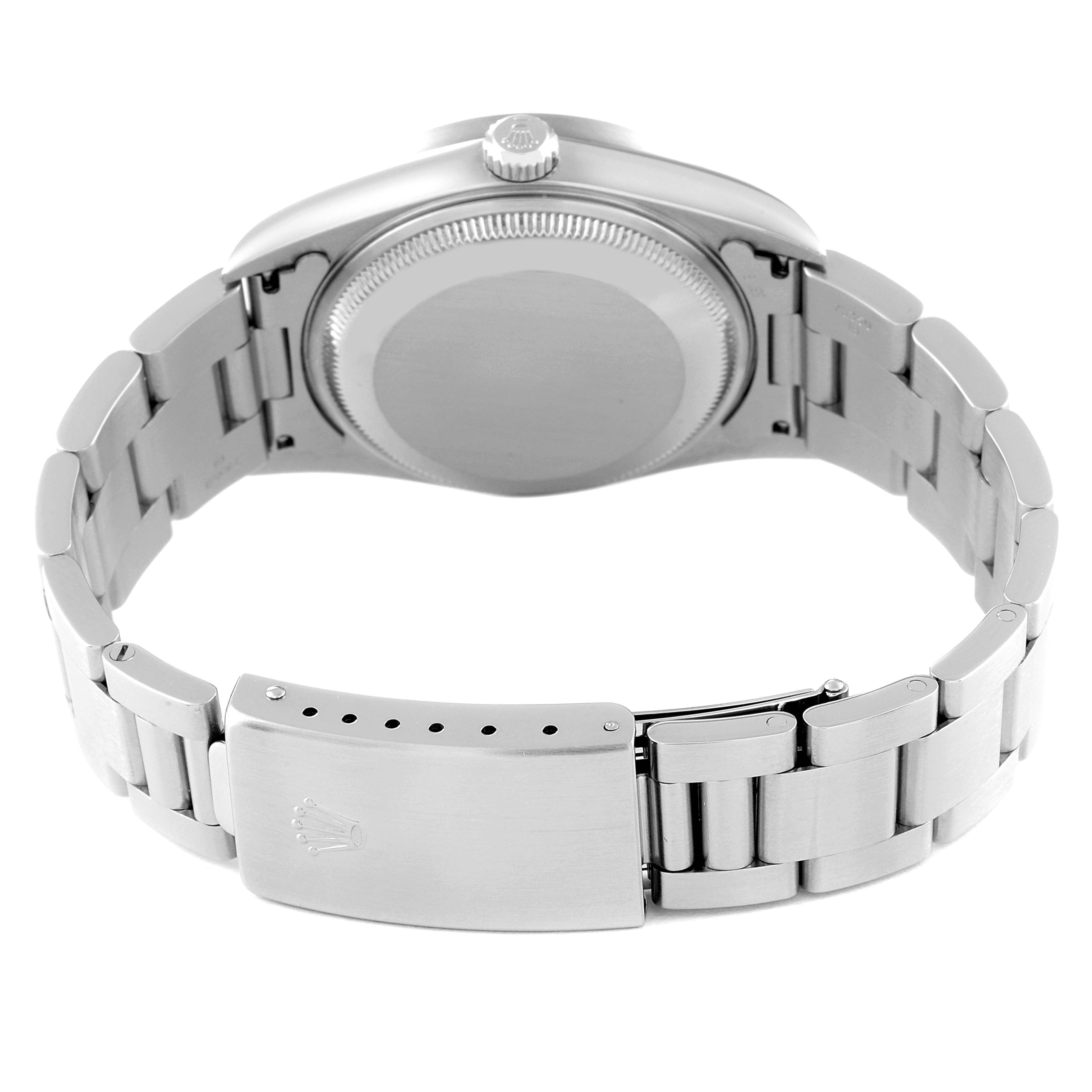 The image shows the back view of a Rolex Date 15210 Men's Stainless Steel Silver Dial 15210 Men's Stainless Steel Silver Dial model, including its case back, crown, and metal bracelet with clasp.