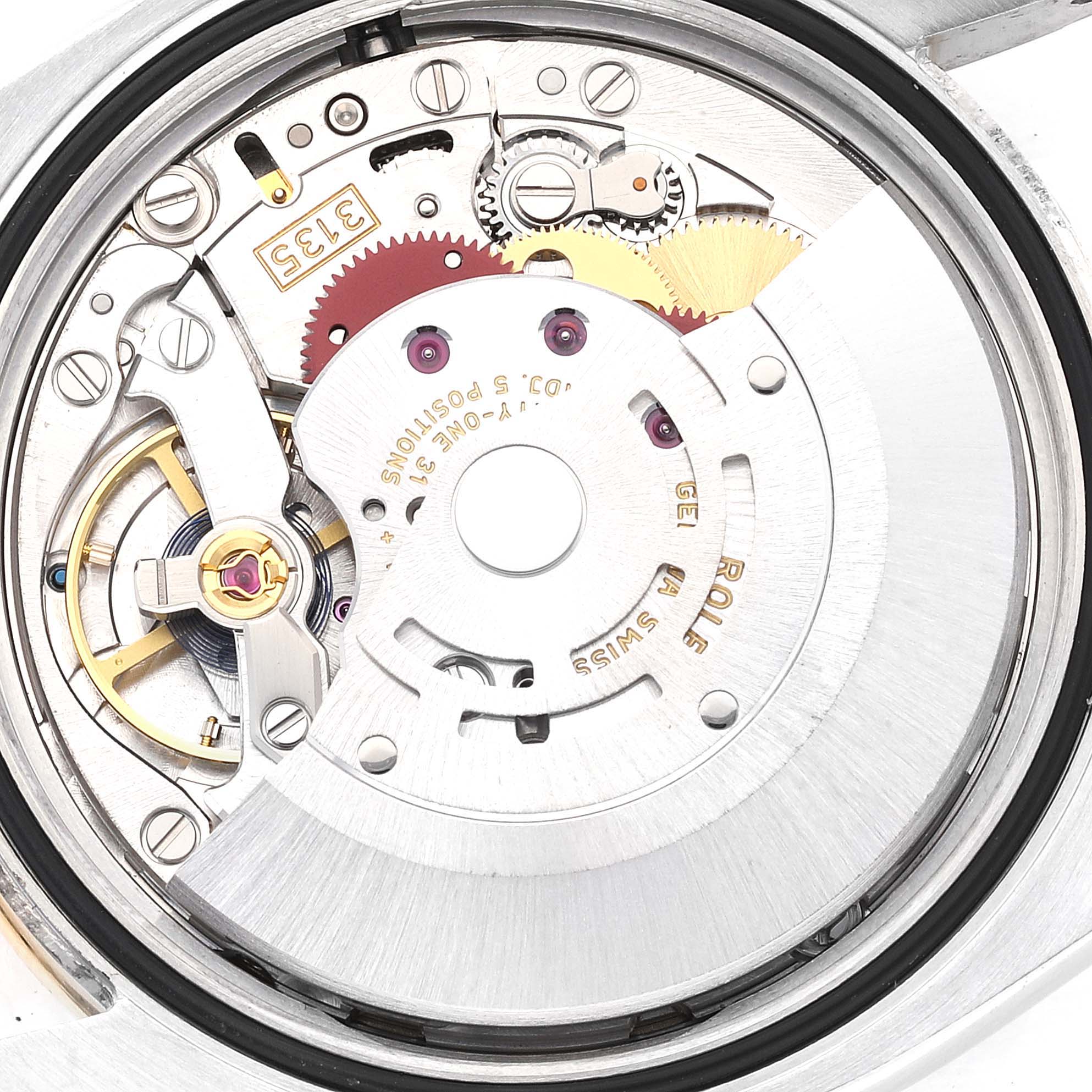 The image shows a close-up of the movement and internal mechanism of a Rolex Datejust 116243 Men's Steel and Gold (two tone) Champagne Dial 116243 Men's Steel and Gold (two tone) Champagne Dial watch.