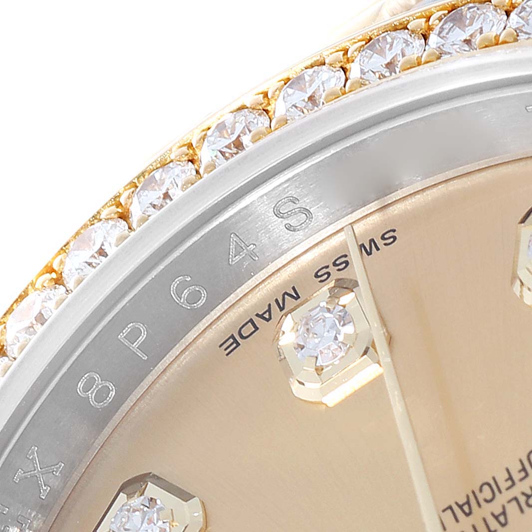 The image shows a close-up angle of the Rolex Datejust 116243 Men's Steel and Gold (two tone) Champagne Dial 116243 Men's Steel and Gold (two tone) Champagne Dial model, highlighting part of the bezel with diamonds and the "Swiss Made" text on the dial.