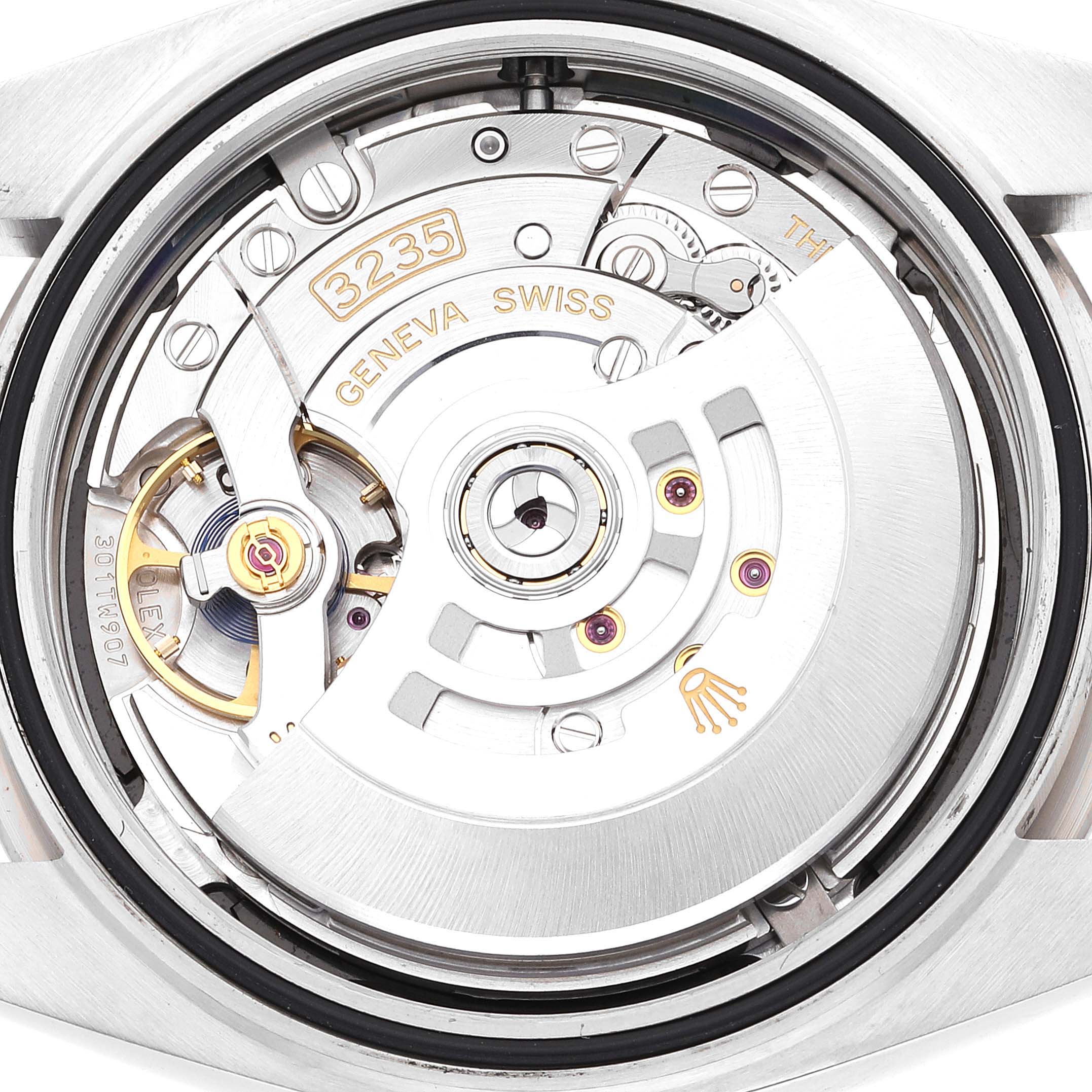 This image shows the movement mechanism of a Rolex Datejust 41 126334 Men's Stainless Steel Black Dial 126334 Men's Stainless Steel Black Dial model, viewed from the back with its rotor and gears visible.