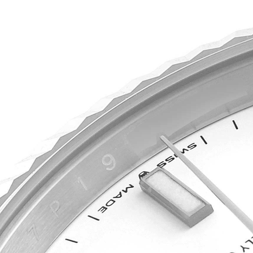 The image shows a close-up angle of the bezel and part of the dial of a Rolex Datejust 41 126334 Men
s Stainless Steel White Dial 126334 Men
s Stainless Steel White Dial watch.
